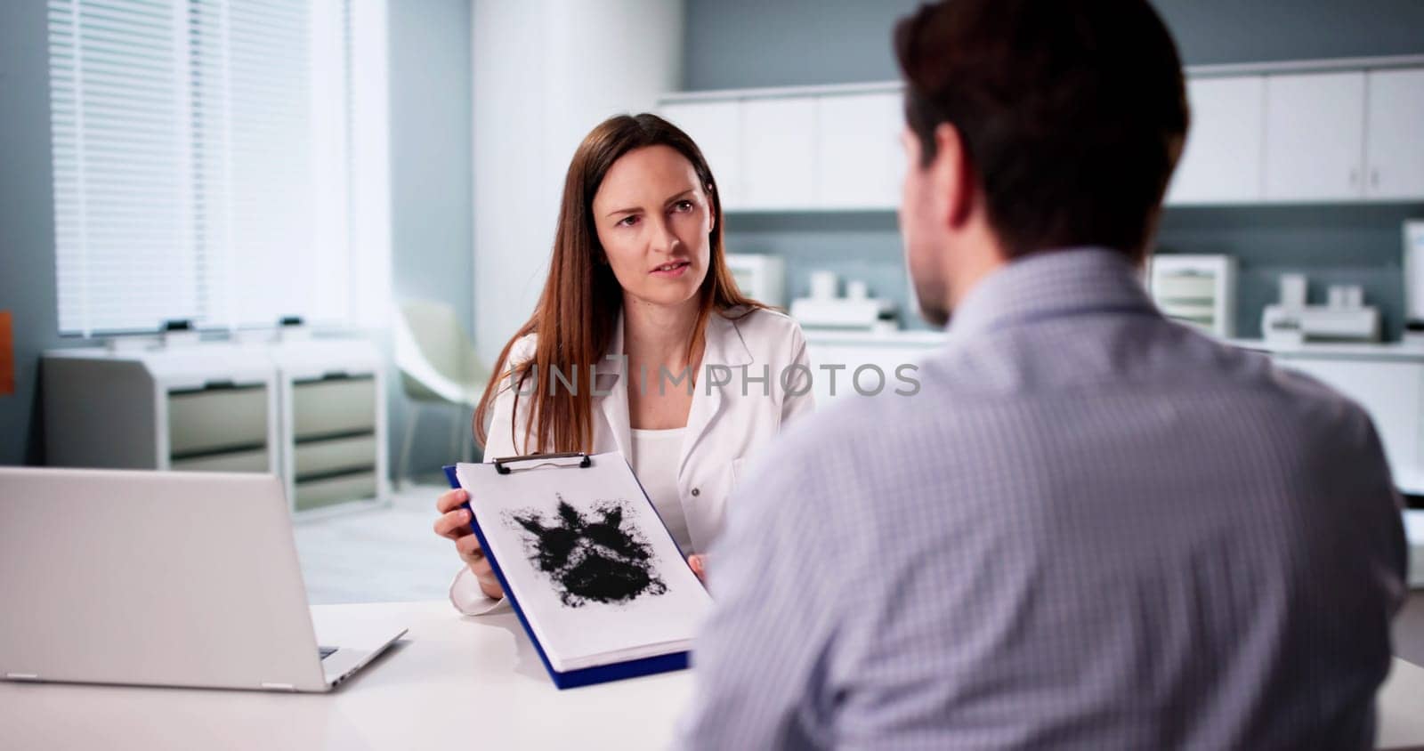 Inkblot Test: Patient Analyzing Rorschach with Female Psychologist Support