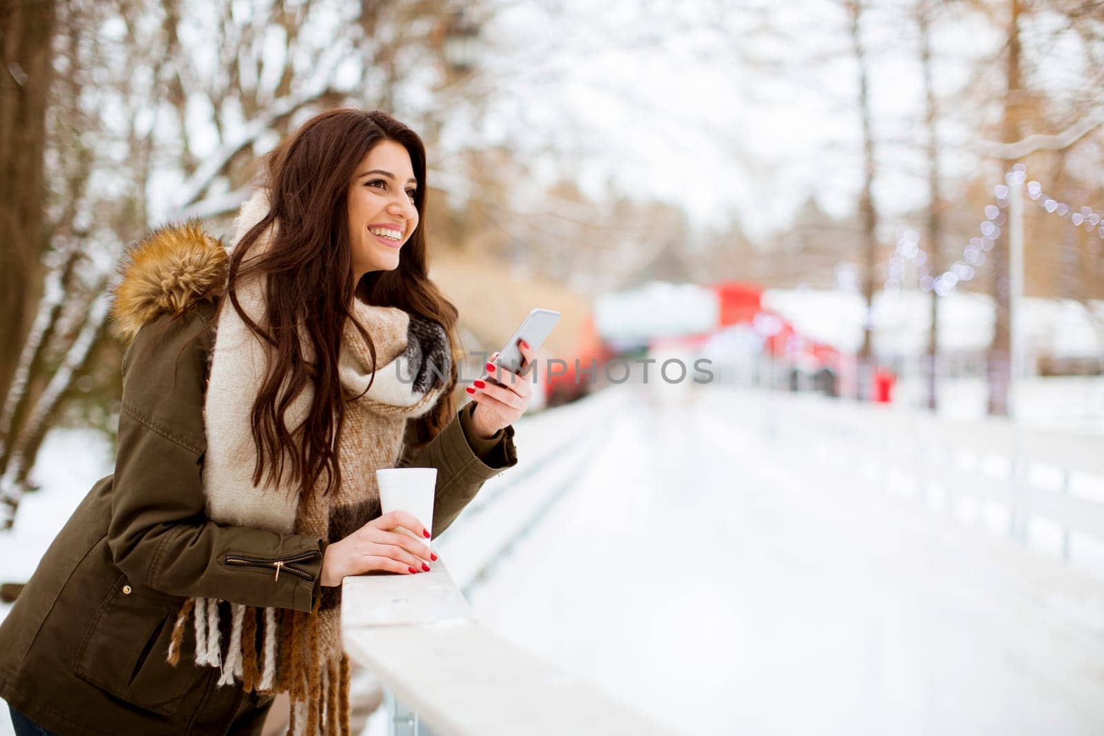 Portrait of young woman in winter park