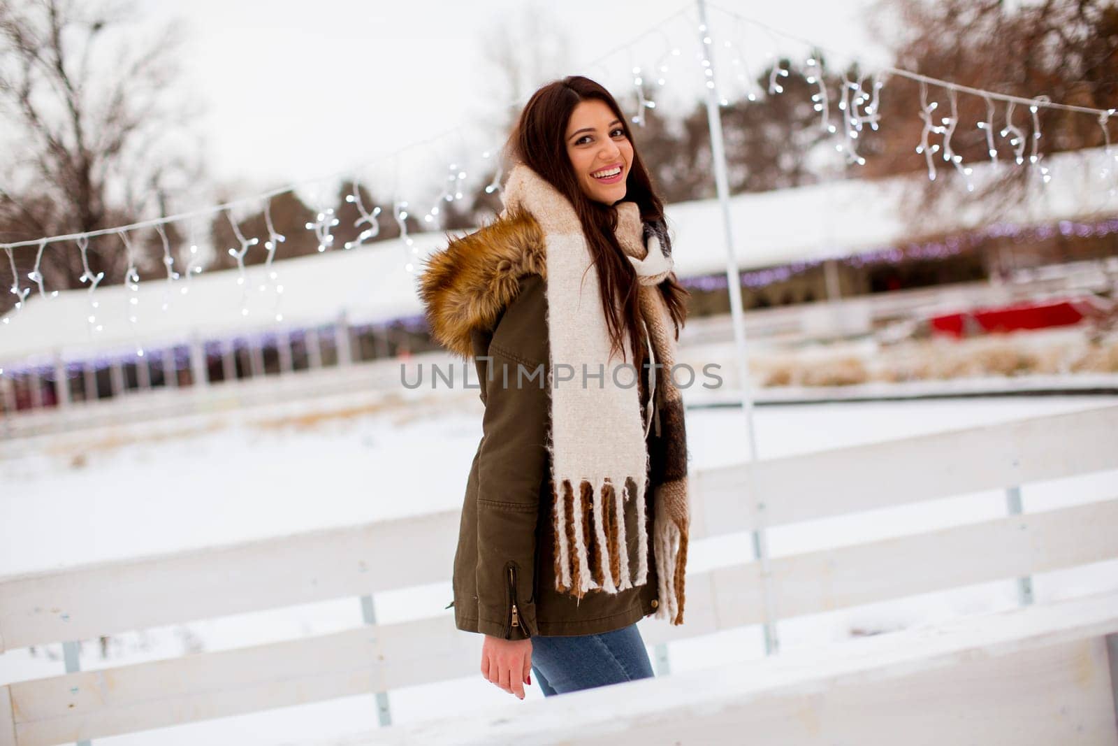 Portrait of young woman in winter park