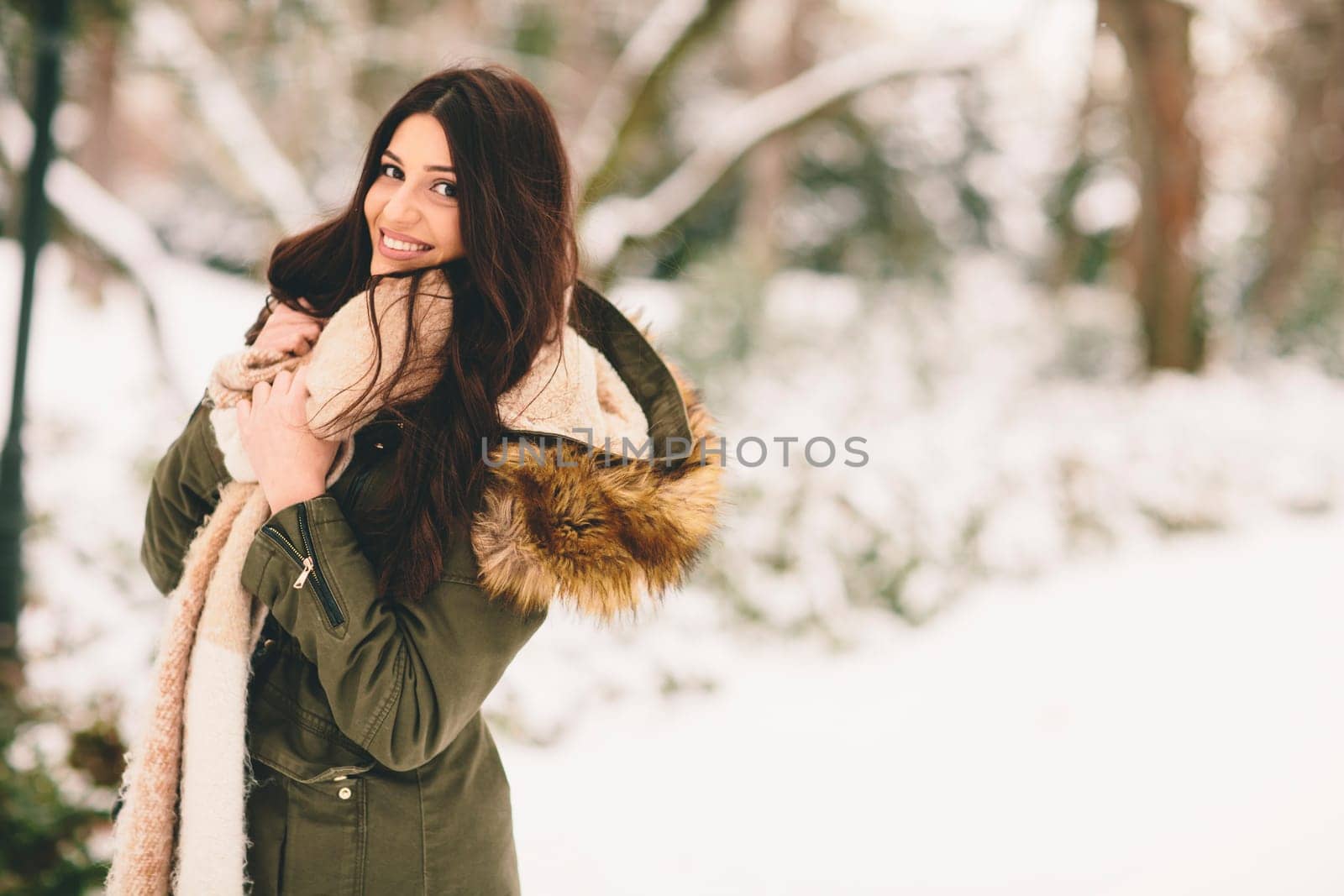 Young woman at cold winter outdoors