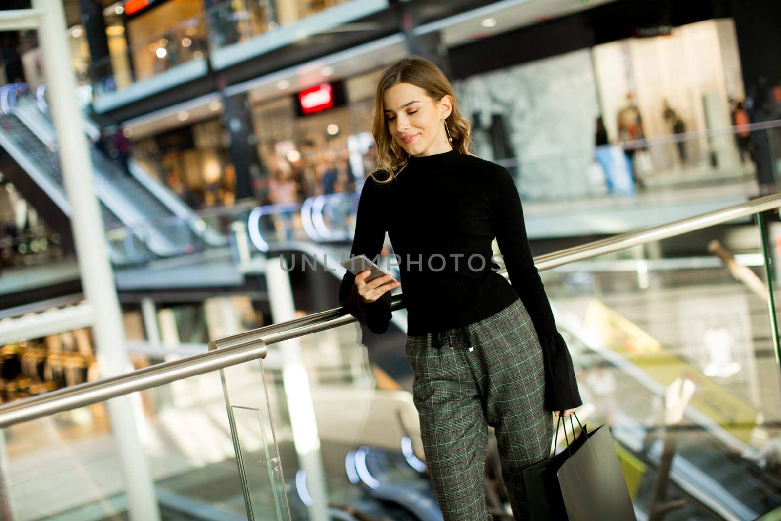 Portrait of modern woman in shopping mall