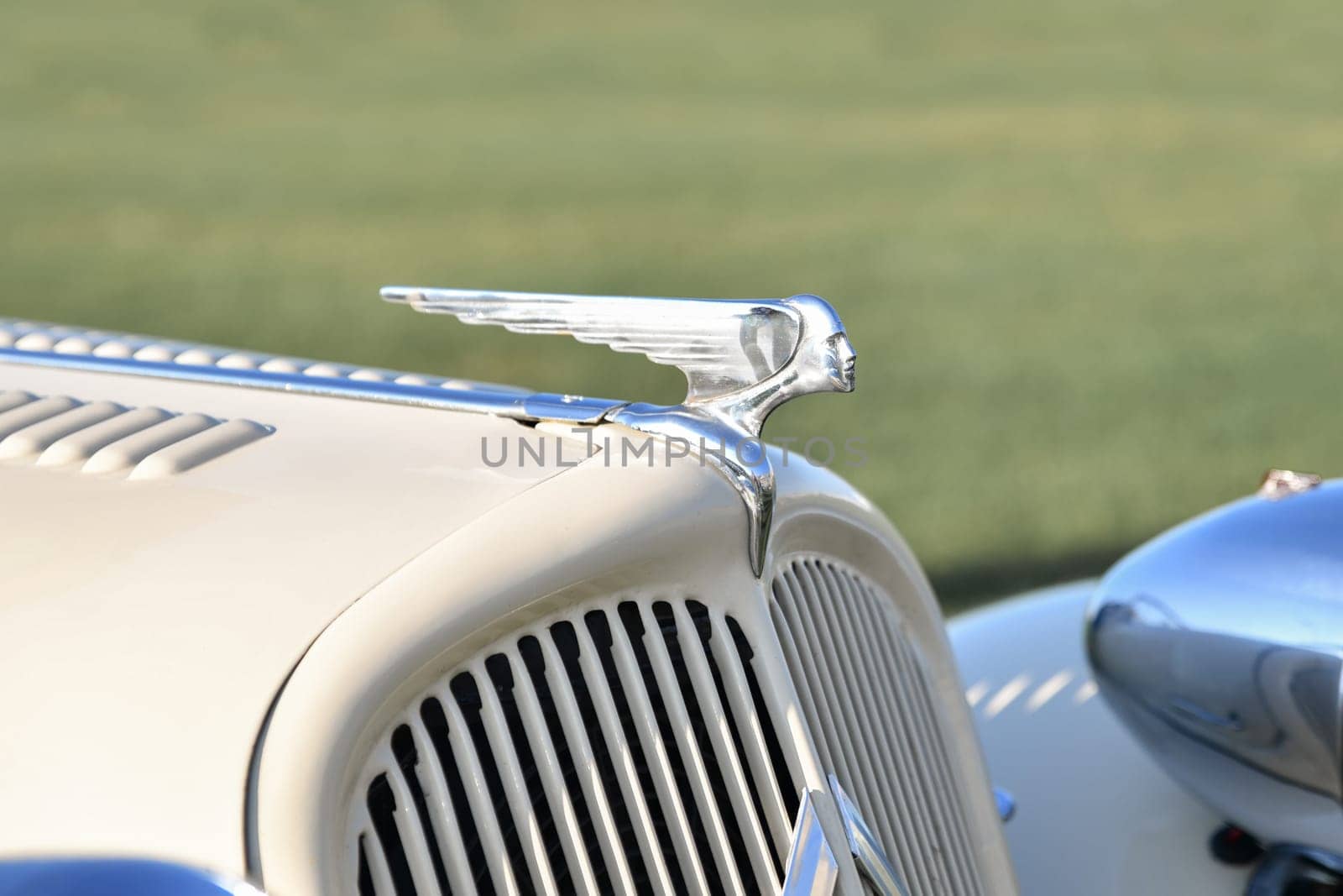 DIEPPE, FRANCE - SEPTEMBER 01, 2018: Head with wings logo ornament on a car