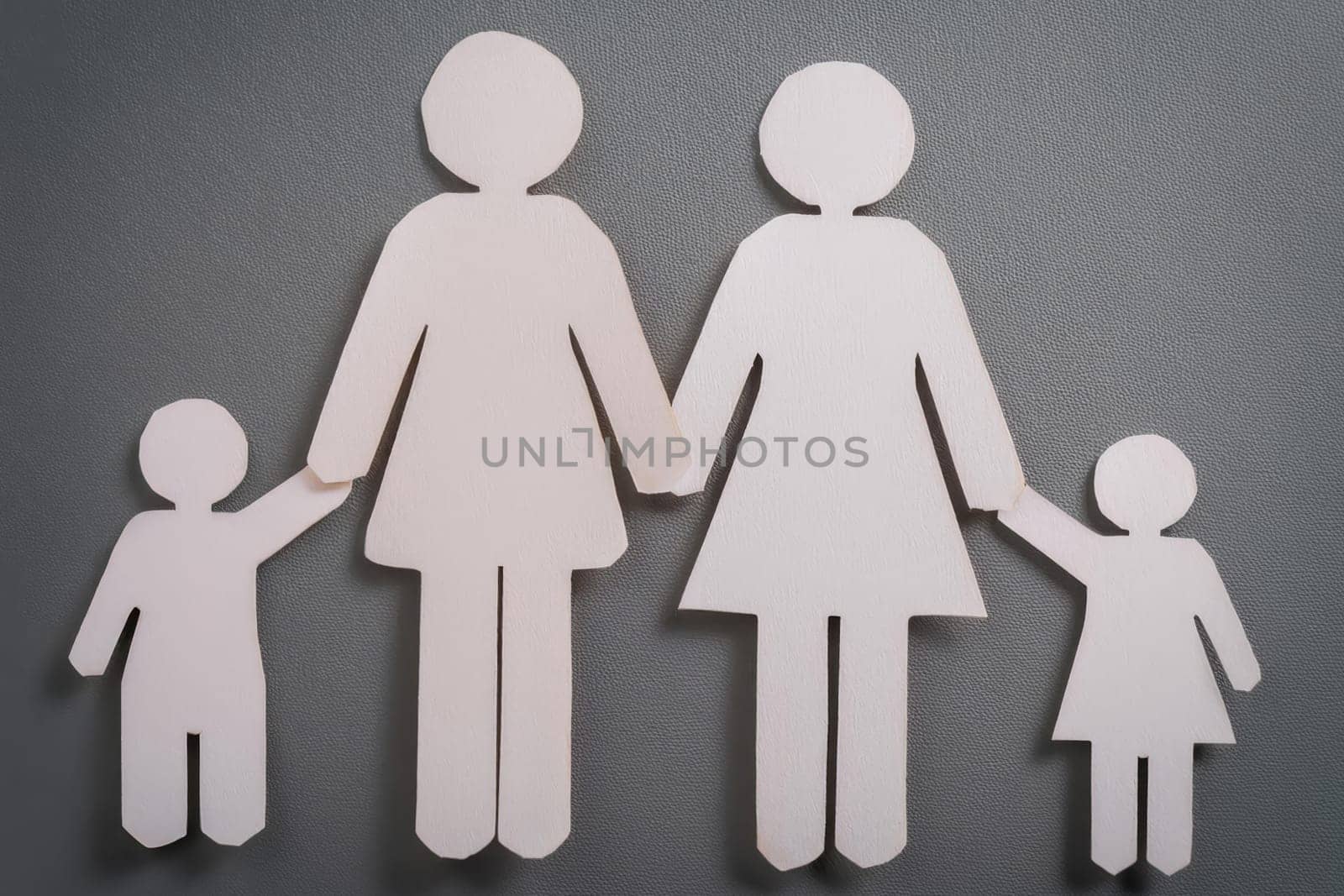 Family with two mothers and two child. LGBT concept. Family of paper cutout figures