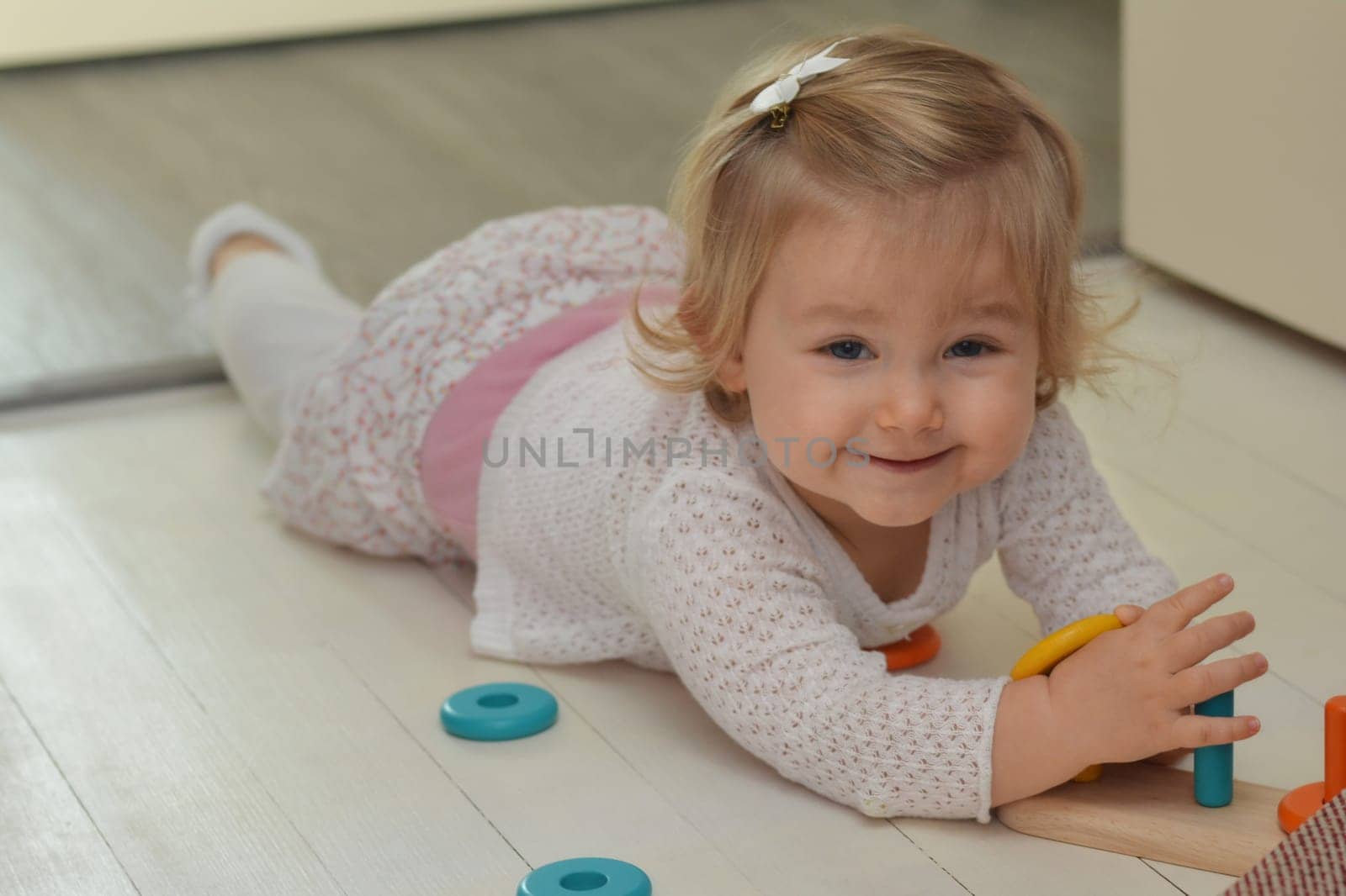 Girl playing with toys in the children's room
