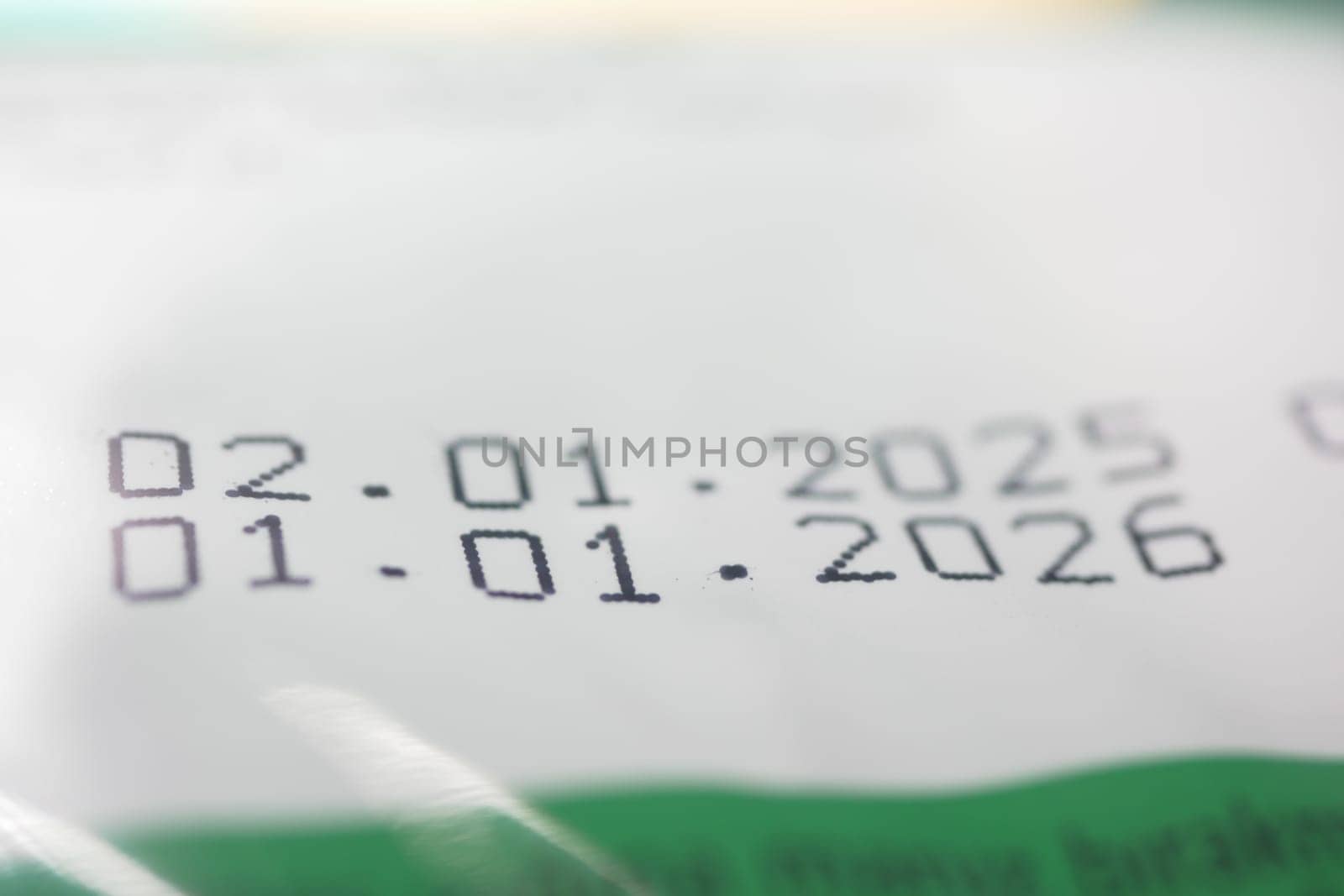 Clear printing of significant dates on package indicating expiration years.