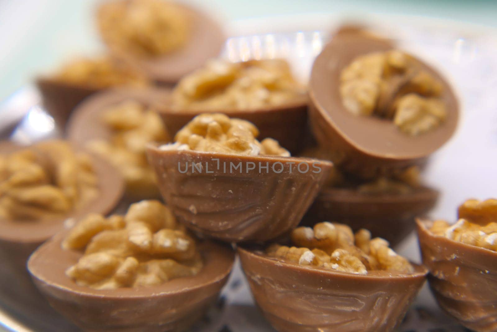 Assorted chocolate candies filled with crunchy nuts ready to enjoy.
