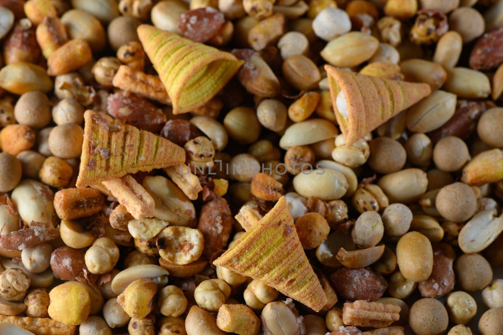 A vibrant mix of nuts, seeds, and playful cone-shaped snacks creates an inviting and appetizing display.