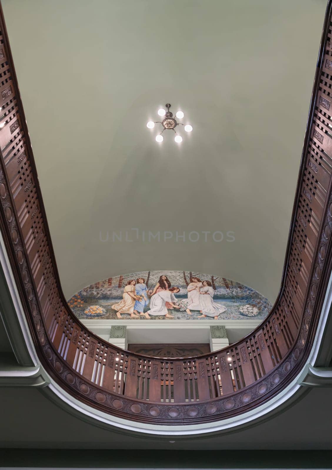 Bangkok, Thailand - Mar 02, 2025 - Mural painting "Six Angels" painted in the fresco technique by Carlo Rigoli, Above the entrance to the bedroom of Bang Khun Phrom Palace or Bank of Thailand Museum. Architectural splendour colonial-style, use it as your Wallpaper, Poster and Copy space, Selective focus.