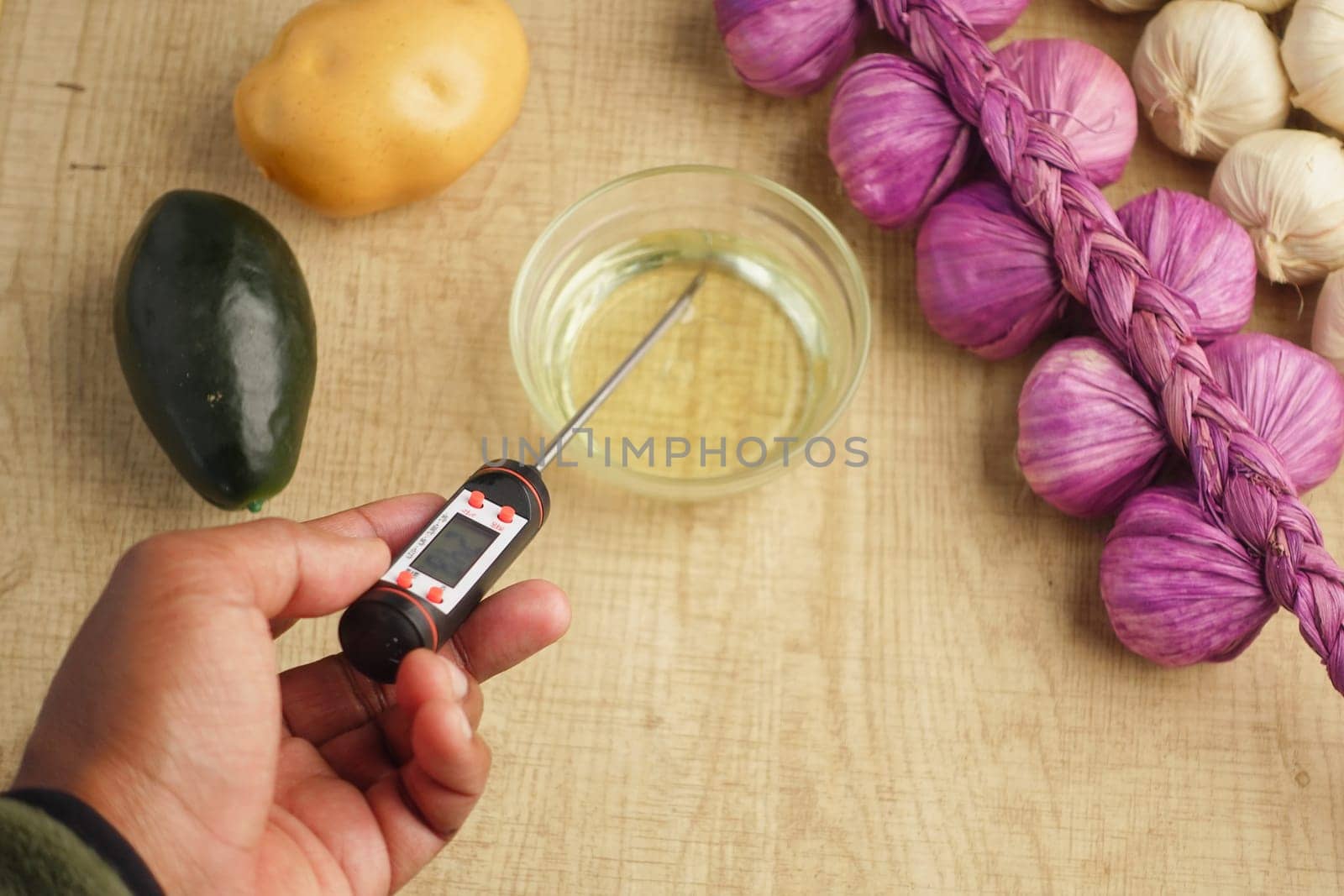 Checking oil temperature for cooking.