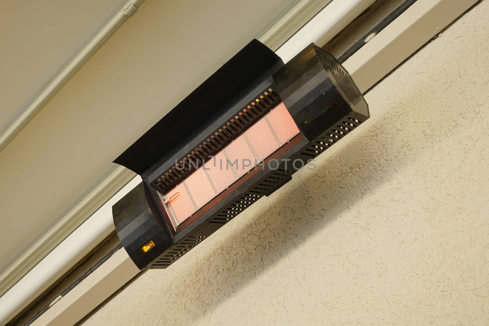 Patio electric heater warms the space for evening use.