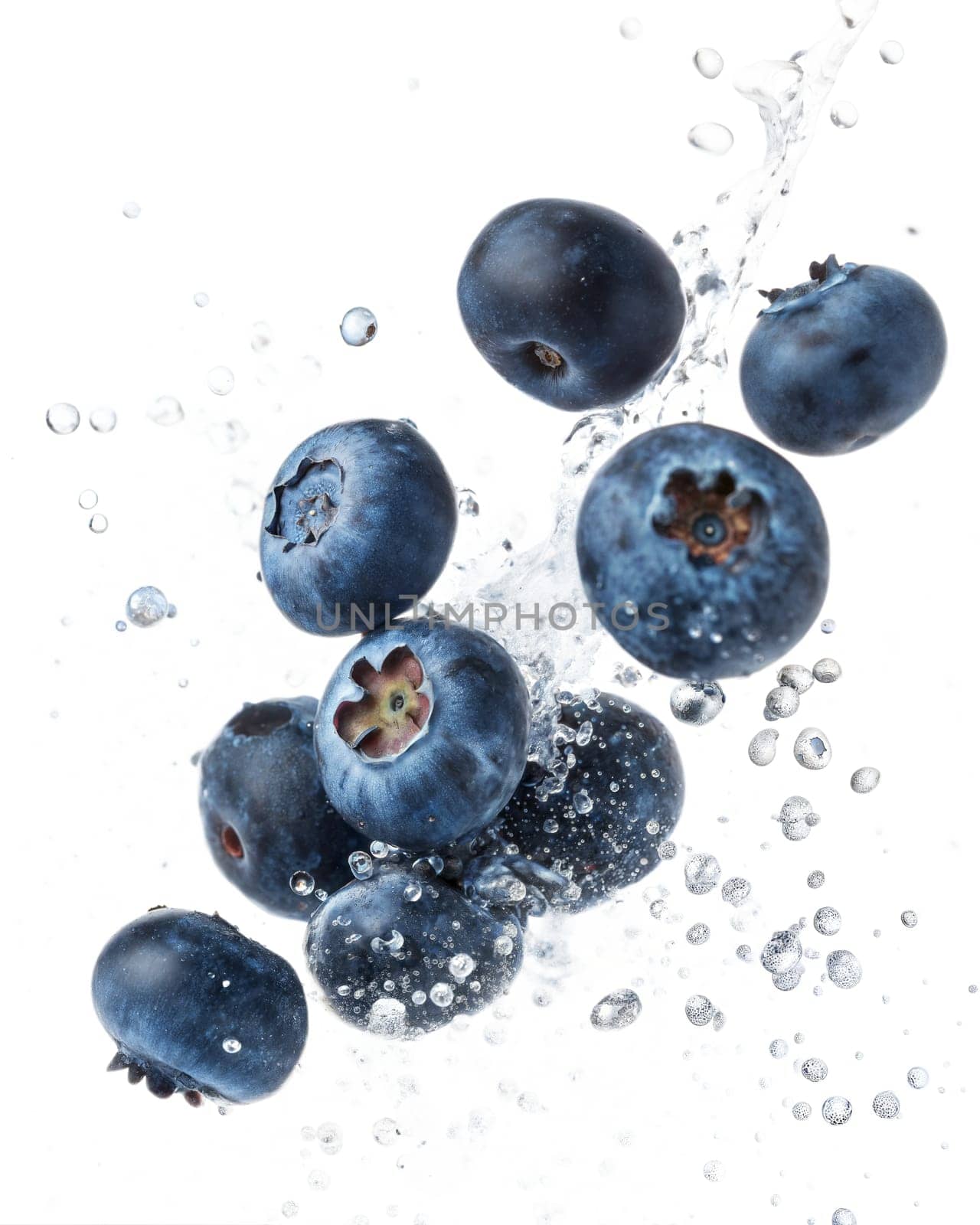 Juicy blueberries splashing in water, isolated on white background. Perfect for healthy eating, fresh fruit, and diet concepts.