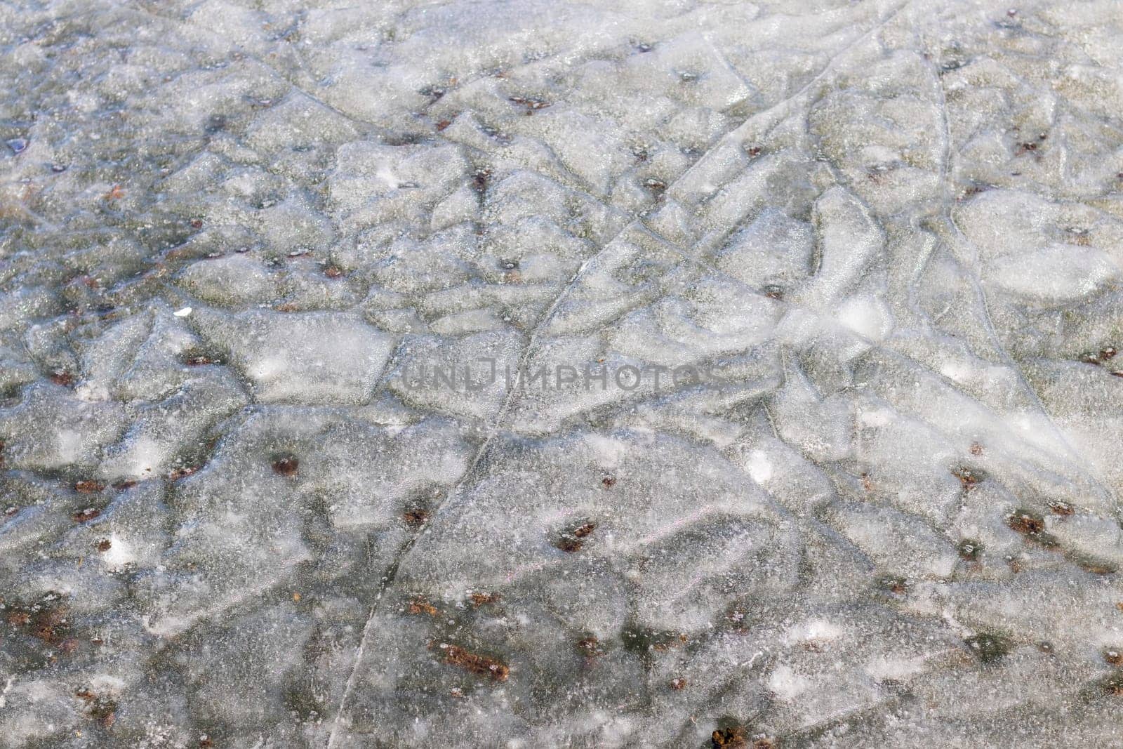 Lake covered with thawed ice