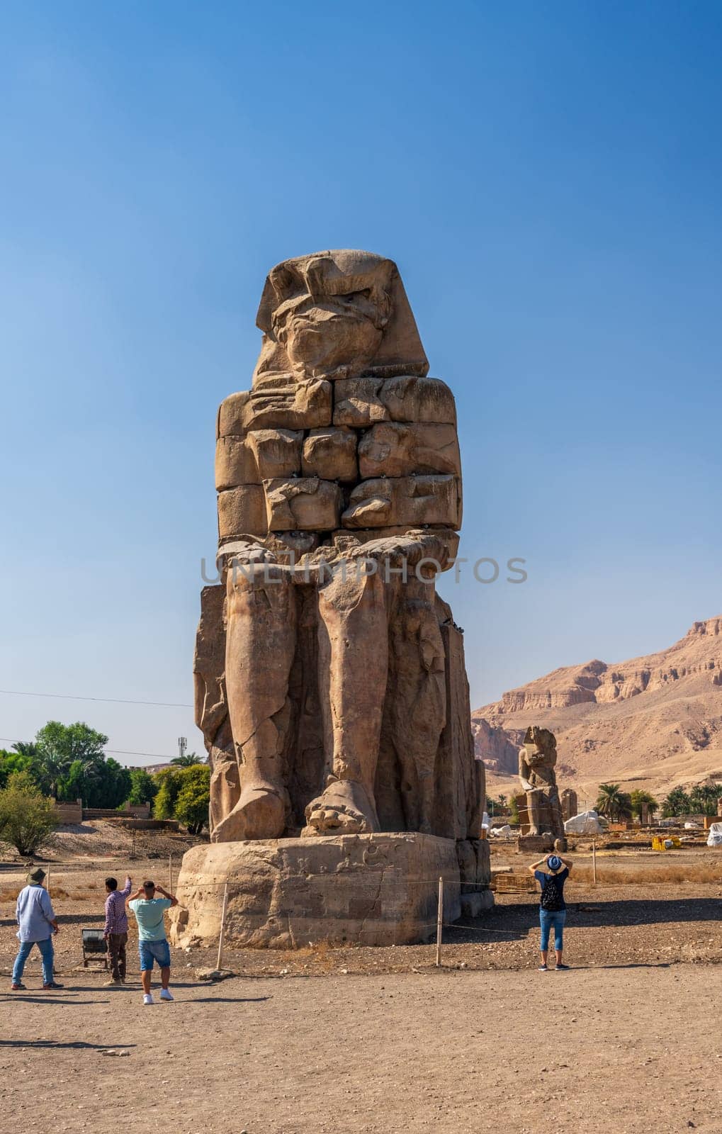 The Colossi of Memnon are two massive stone statues of the Pharaoh Amenhotep III, located on the West Bank of Luxor, Egypt.