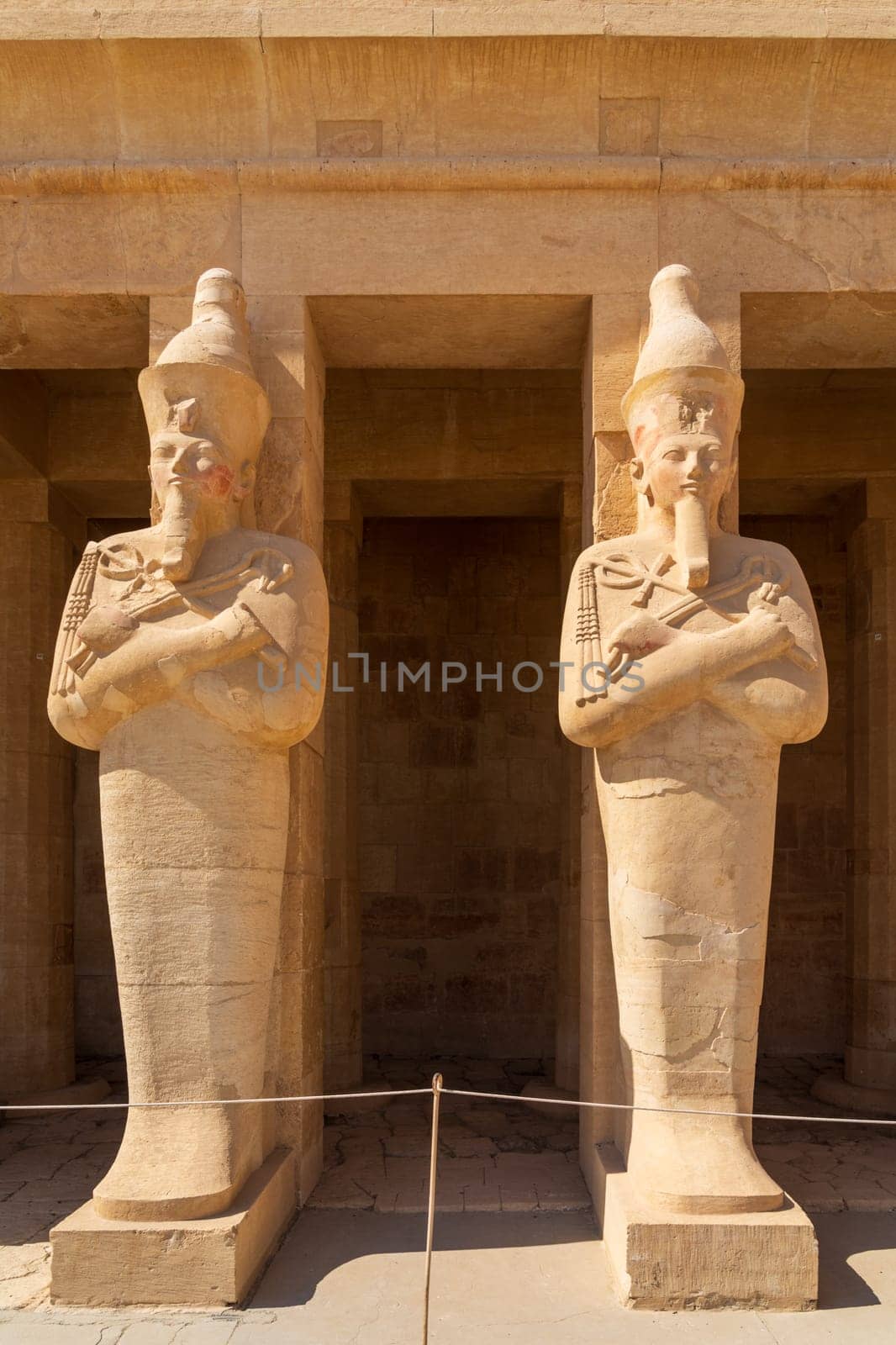 Large statues of two pharoahs at Hatshepsut Temple near Luxor Egypt by the columns of the Mortuary
