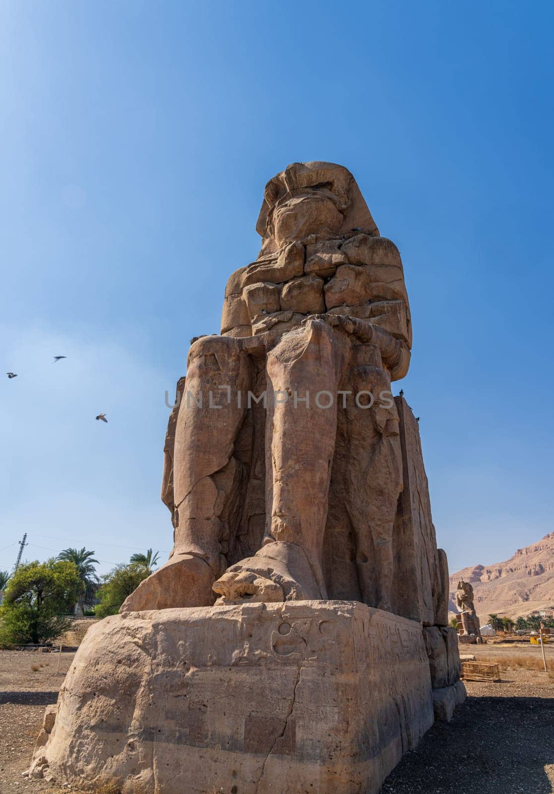 The Colossi of Memnon are two massive stone statues of the Pharaoh Amenhotep III, located on the West Bank of Luxor, Egypt.
