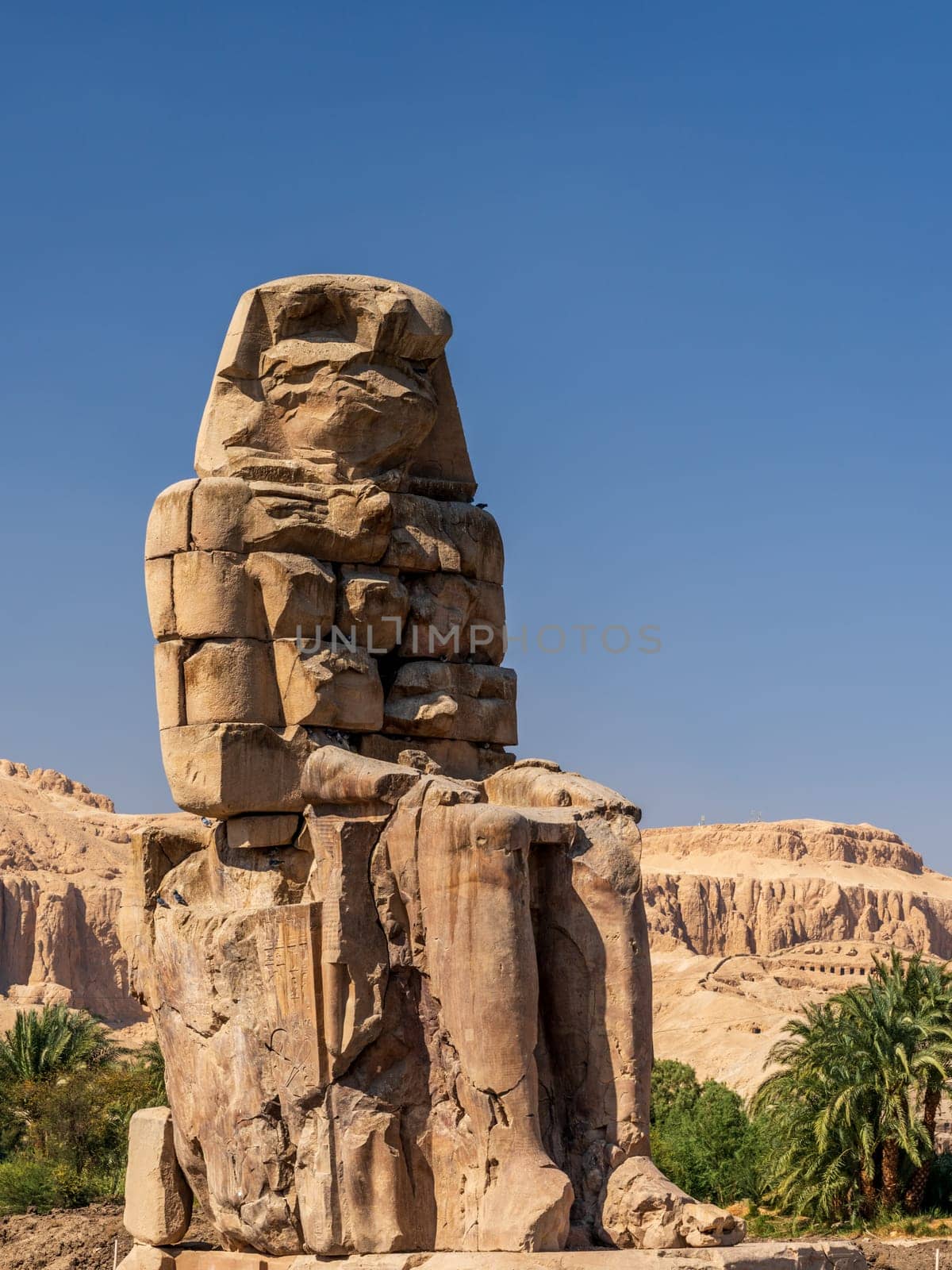 The Colossi of Memnon are two massive stone statues of the Pharaoh Amenhotep III, located on the West Bank of Luxor, Egypt.