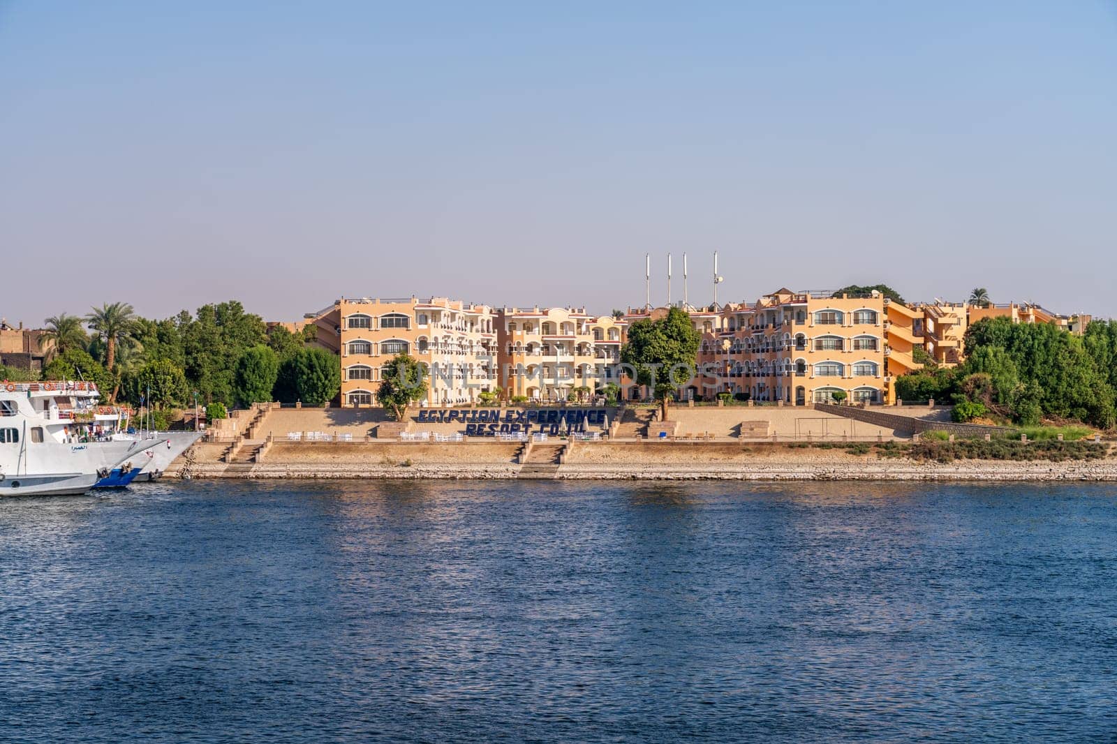 Luxor, Egypt - 2 November 2024: Many Nile River cruise ships are docked alongside each other by Egyptian Experience Resort