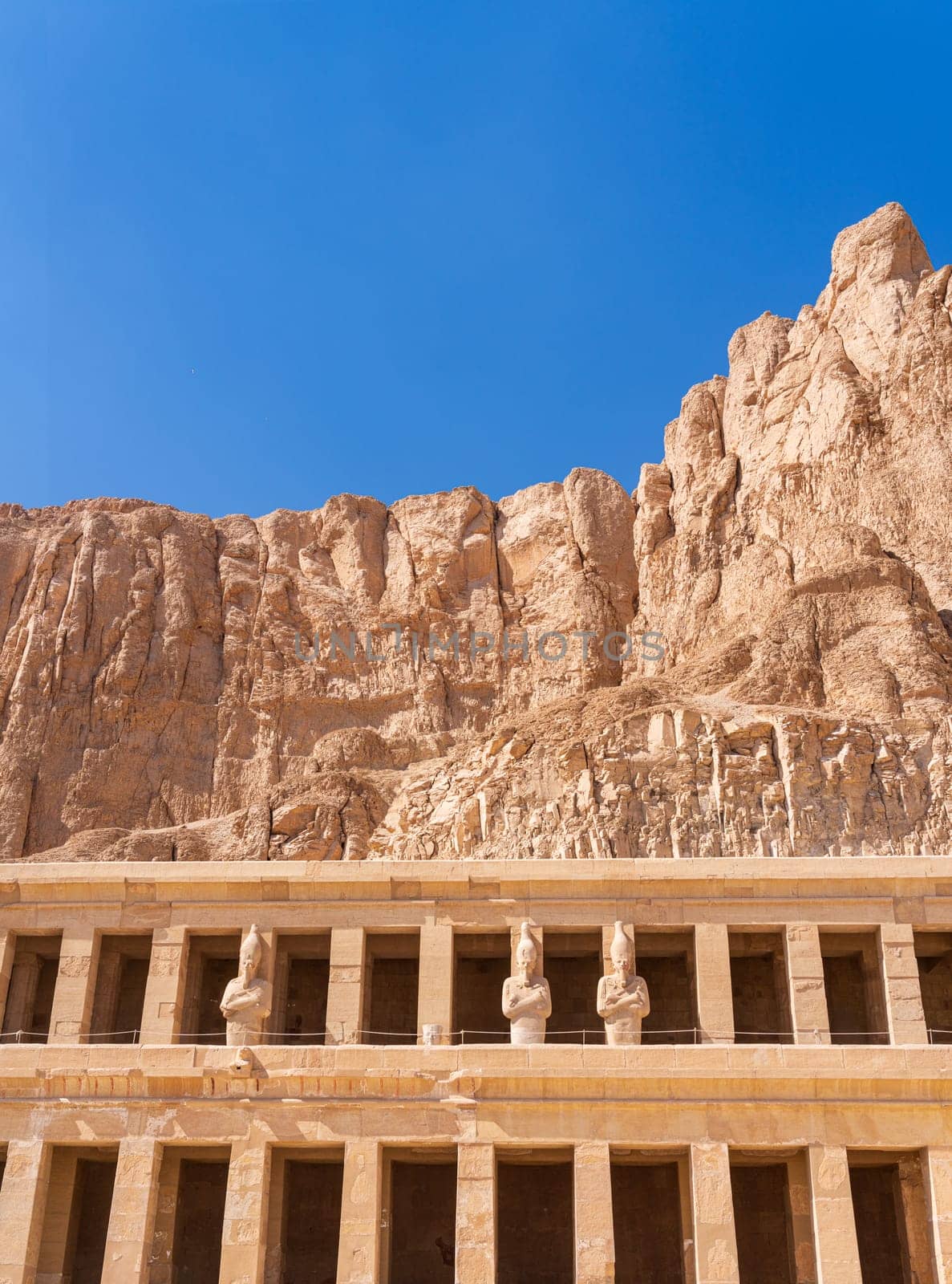 Large statues of pharoahs at Hatshepsut Temple near Luxor Egypt by the columns of the Mortuary