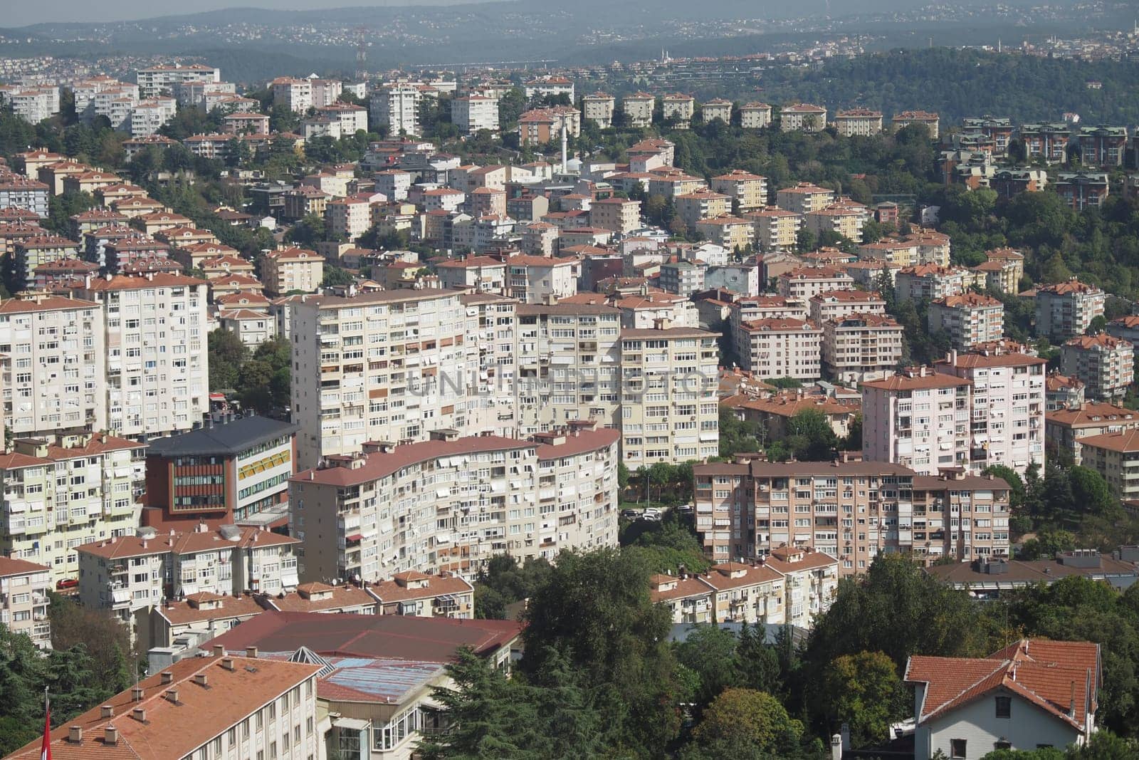 Numerous residential buildings are visible in the suburban landscape.