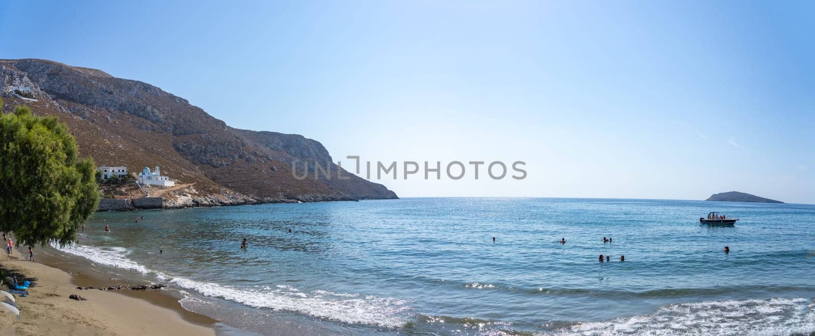 August 26 2024; Idyllic Kantouni Beach on summer day with swimmers in water..