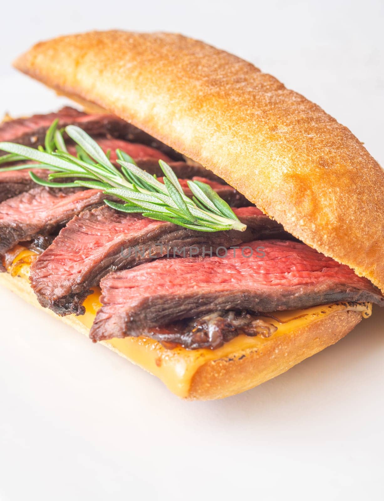 Crispy ciabatta filled with melted cheese, tender steak, sweet onions, and fresh rosemary