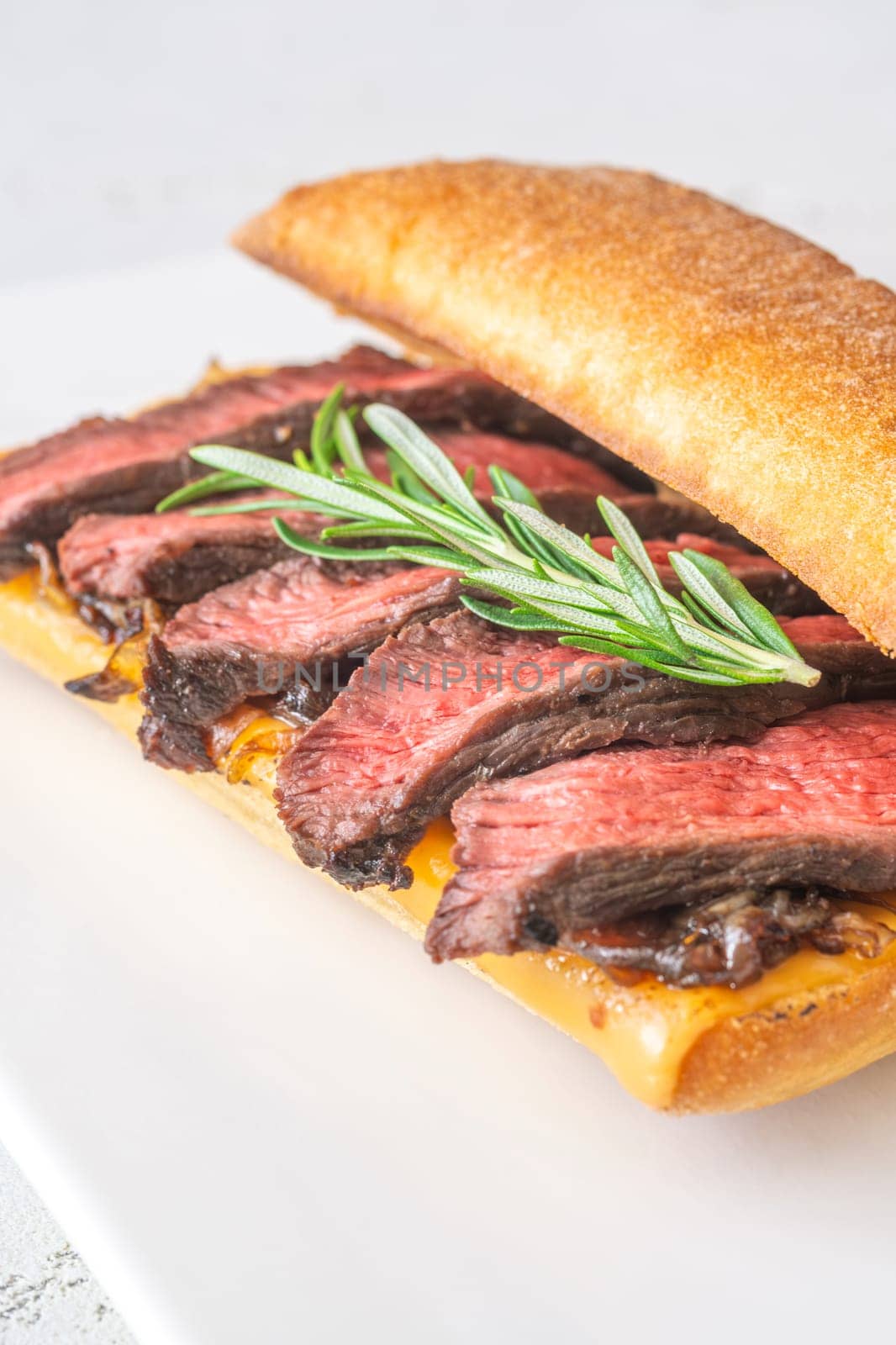 Crispy ciabatta filled with melted cheese, tender steak, sweet onions, and fresh rosemary