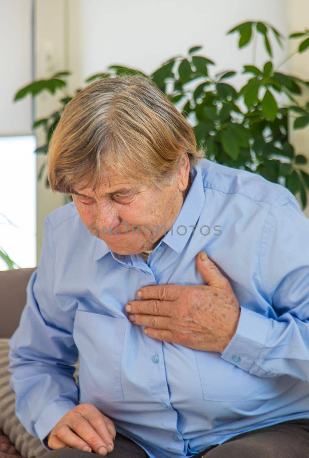 Old woman heart ache. Selective focus. people,