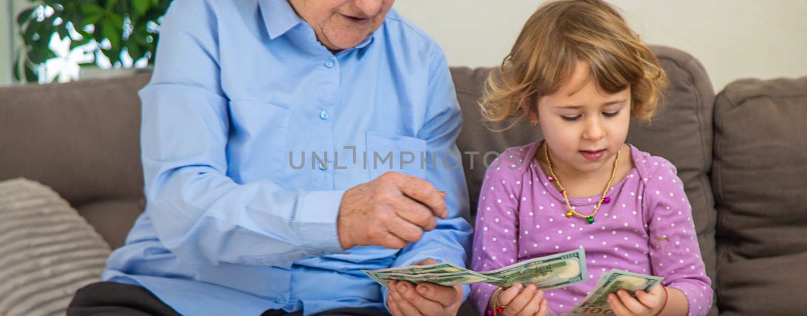 Old woman with her granddaughter. Selective focus. People,