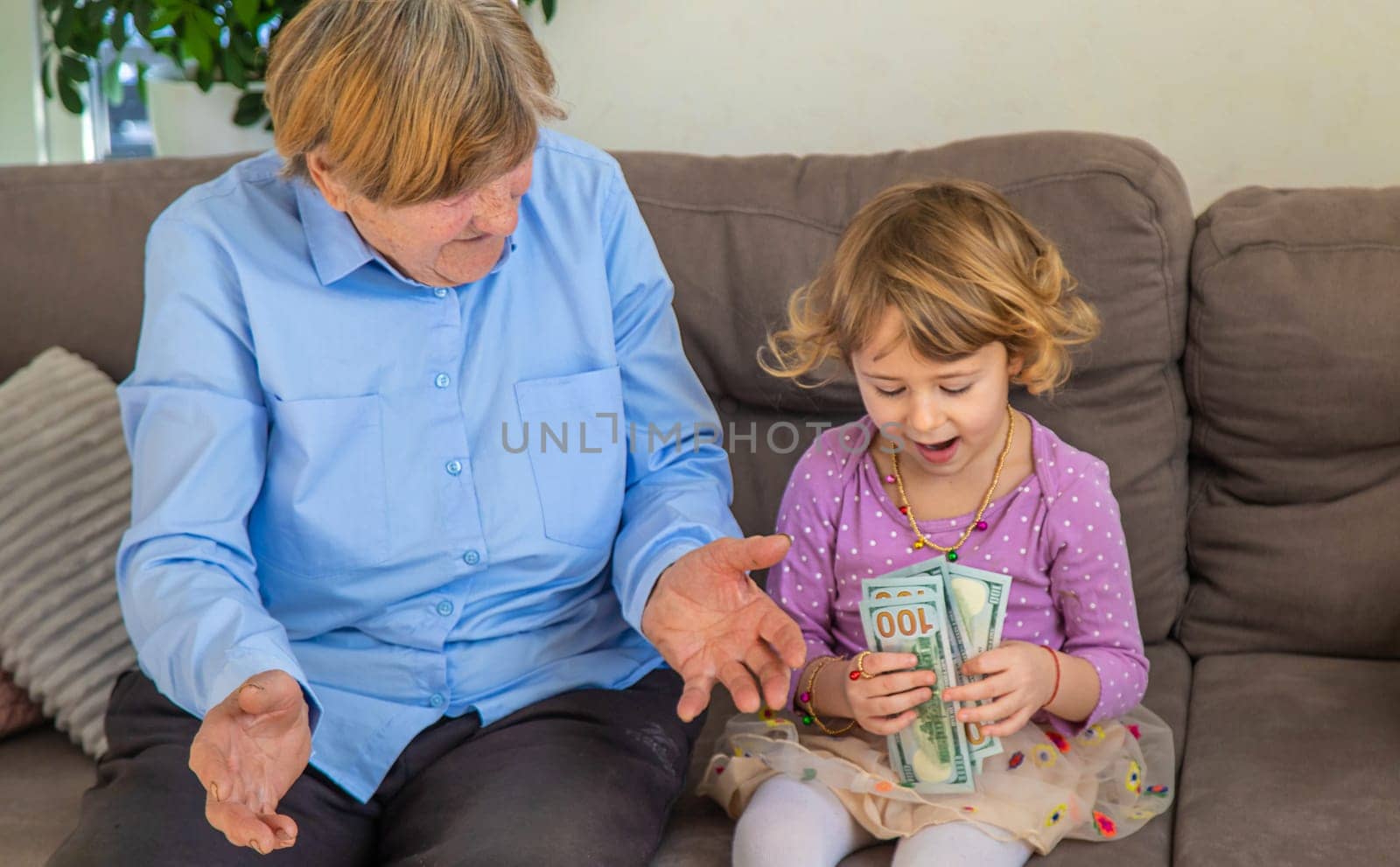 Old woman with her granddaughter. Selective focus. People,