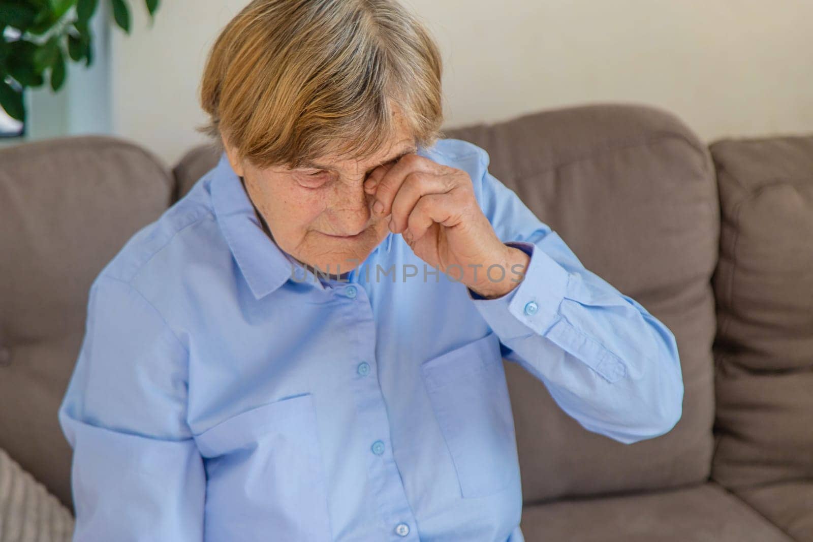 old woman eyes hurt. Selective focus. people.