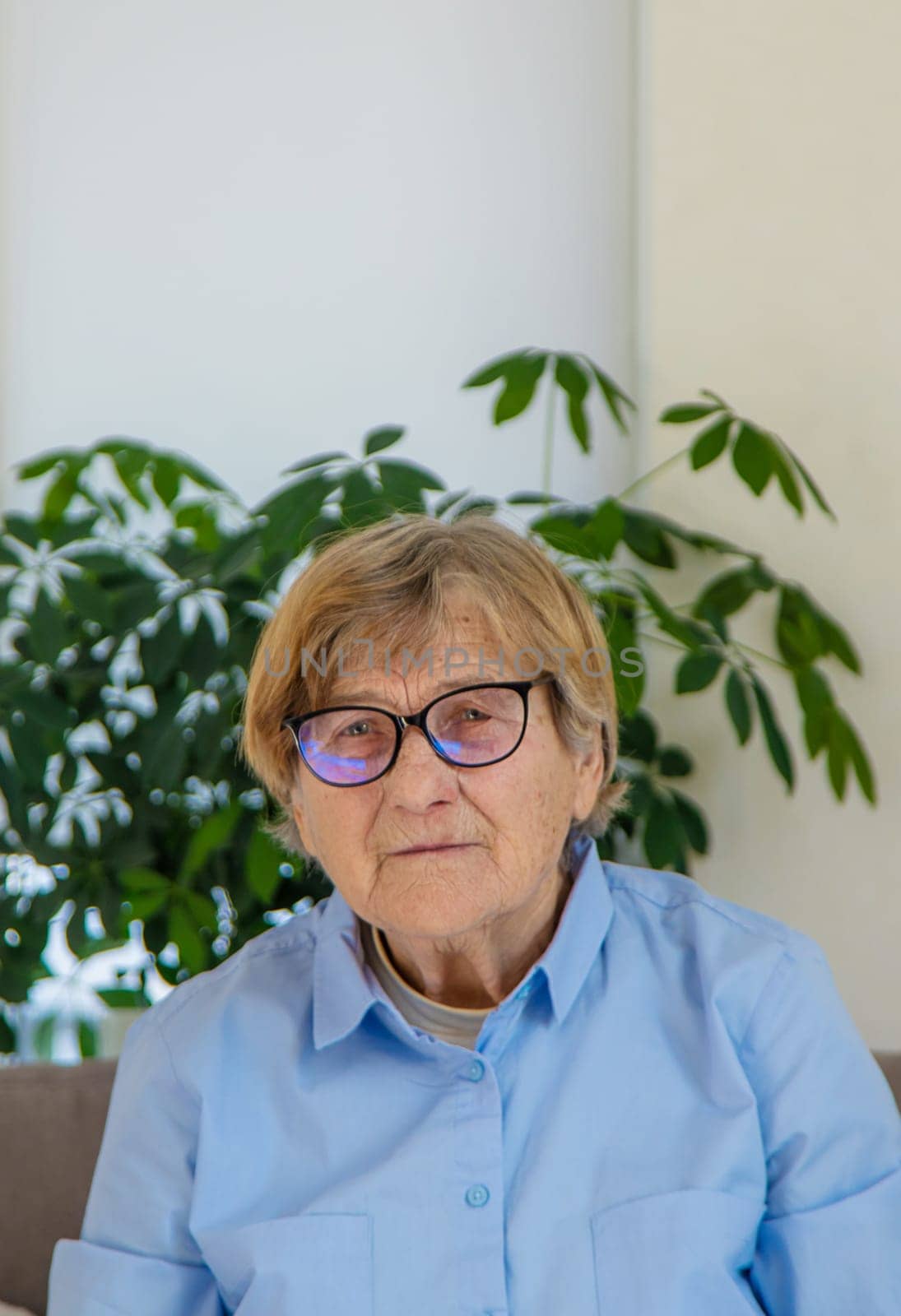 Old woman with glasses portrait. Selective focus. people.