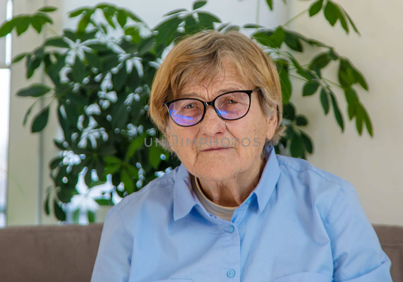 Old woman with glasses portrait. Selective focus. people.