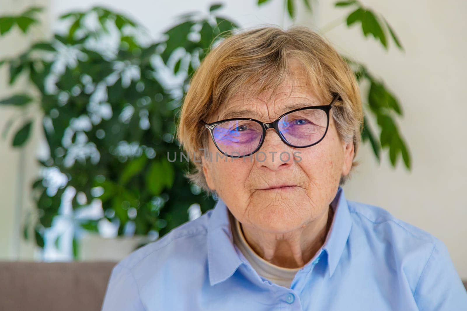 Old woman with glasses portrait. Selective focus. people.