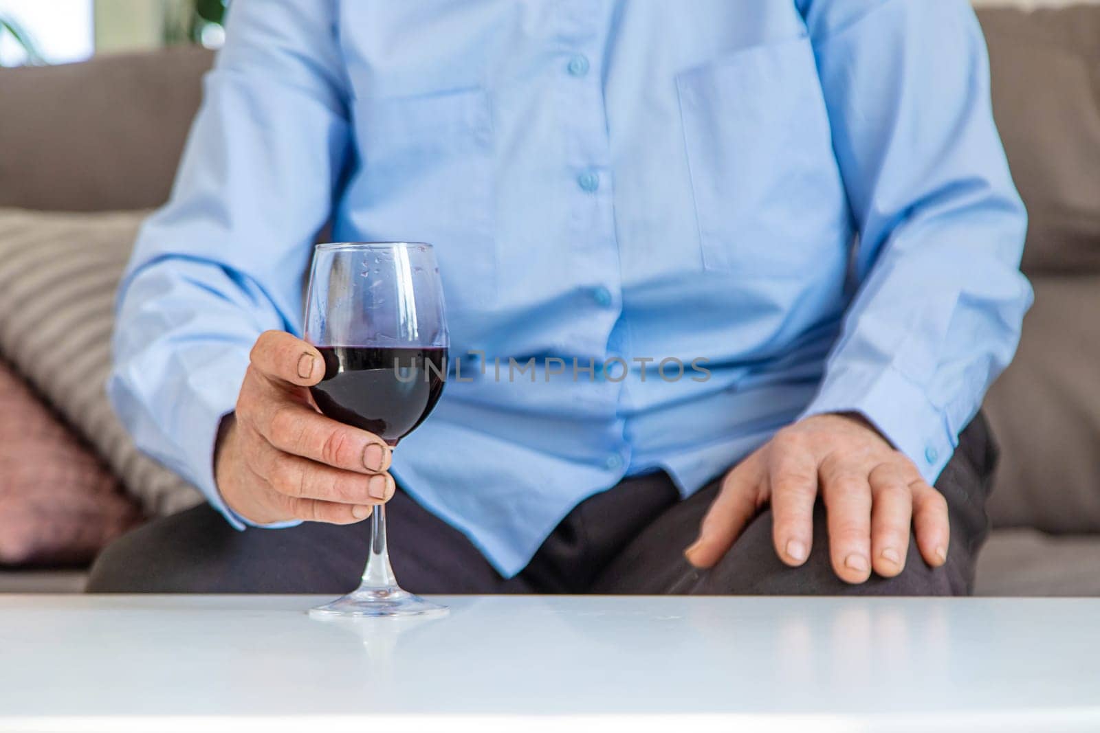 Old woman drinking wine. Selective focus. People,