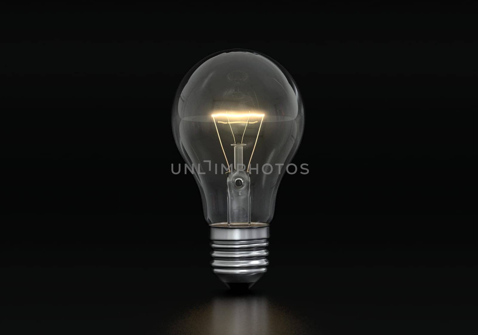 An incandescent light bulb is burning on a black background