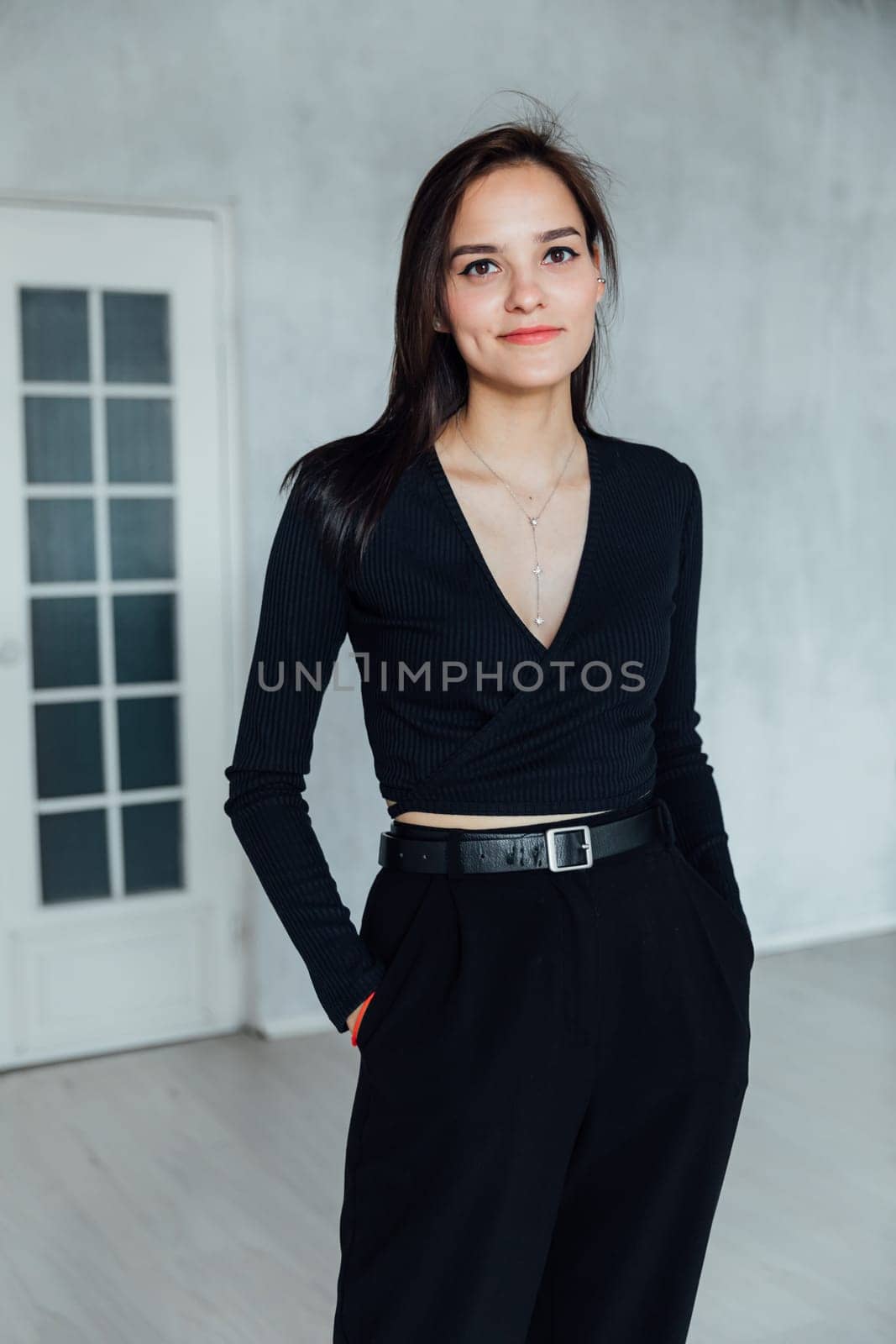 Portrait of Beautiful Young Woman and Brunette on Light Background