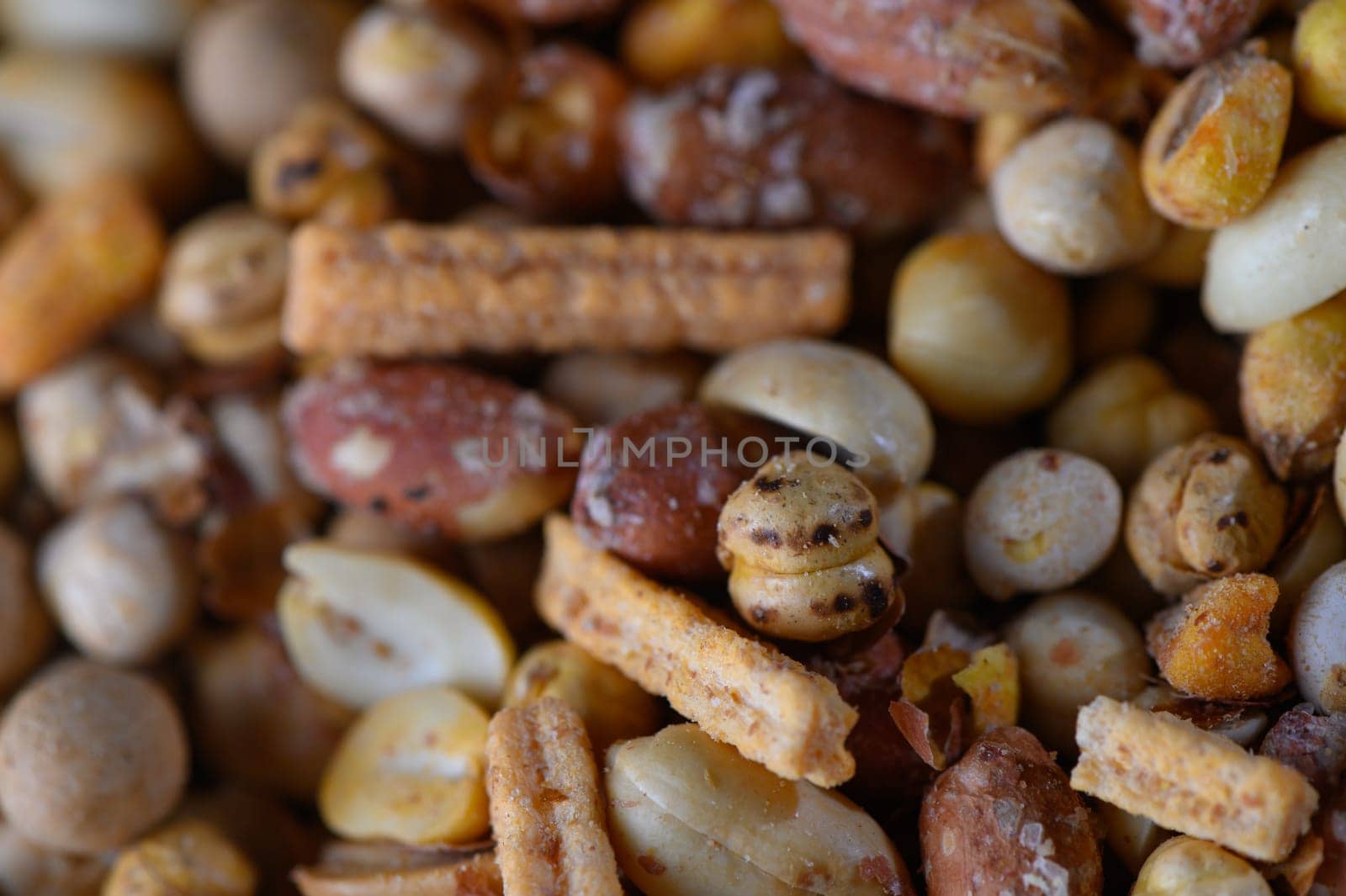 A vibrant mix of nuts and snacks creates an inviting spread perfect for sharing at a cheerful gathering with friends.