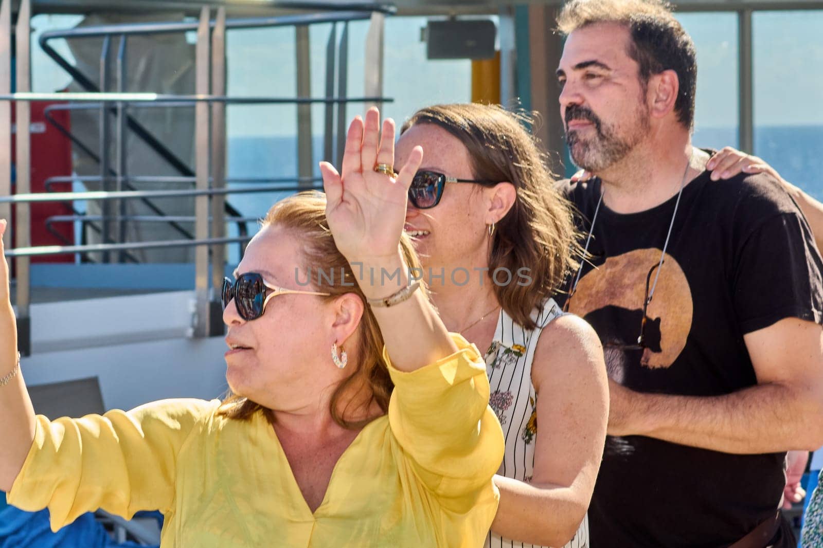 Catania. Italy - March 11, 2025: Energetic crowd interacting during a sunny day activity, capturing lively expressions and a strong sense of camaraderie in the open air.