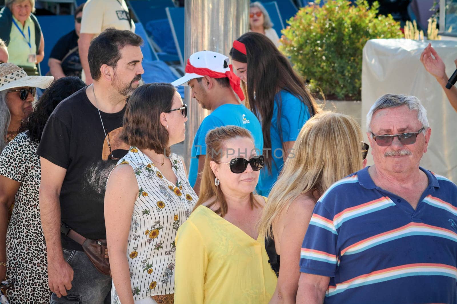 Catania. Italy - March 13, 2025: Energetic group of people gathered at a sunny recreational area, showcasing connection, joy, and harmony during a bright leisure day.