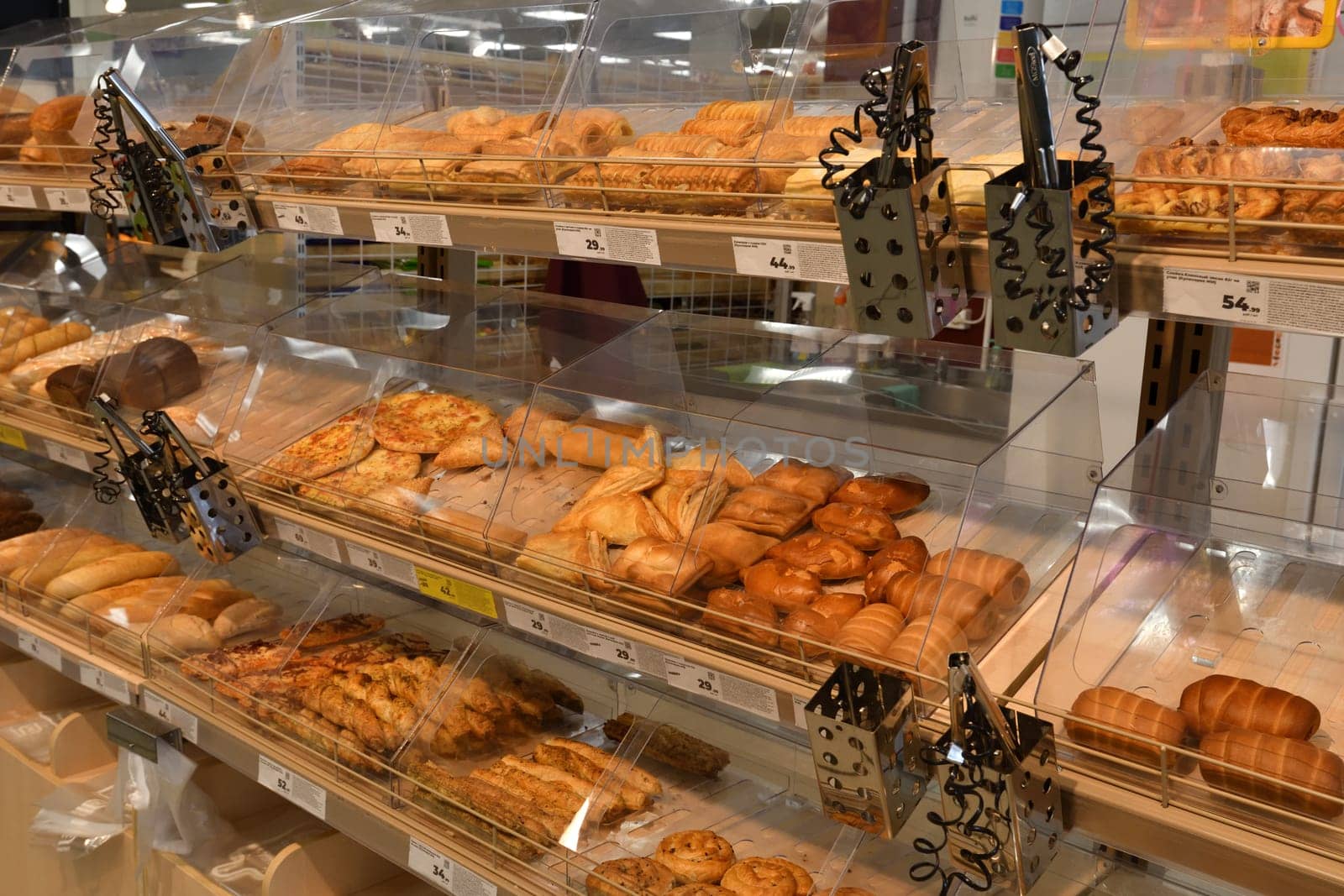 Moscow, Russia - APRIL 7. 2024. Pies and a sweet pastries in the Magnit store - the largest grocery retailer