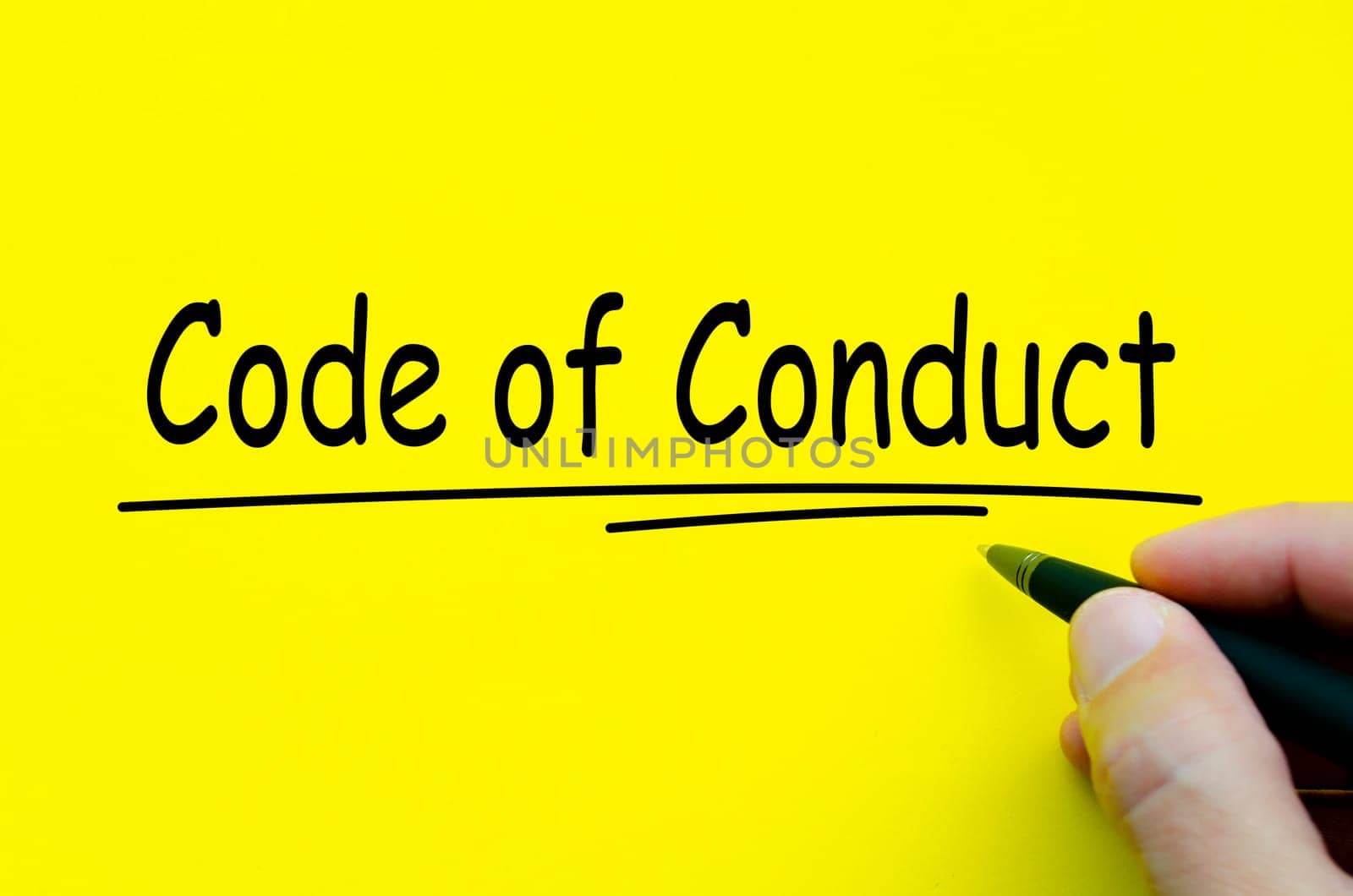 Code of Conduct text on yellow notepad. Business culture concept.