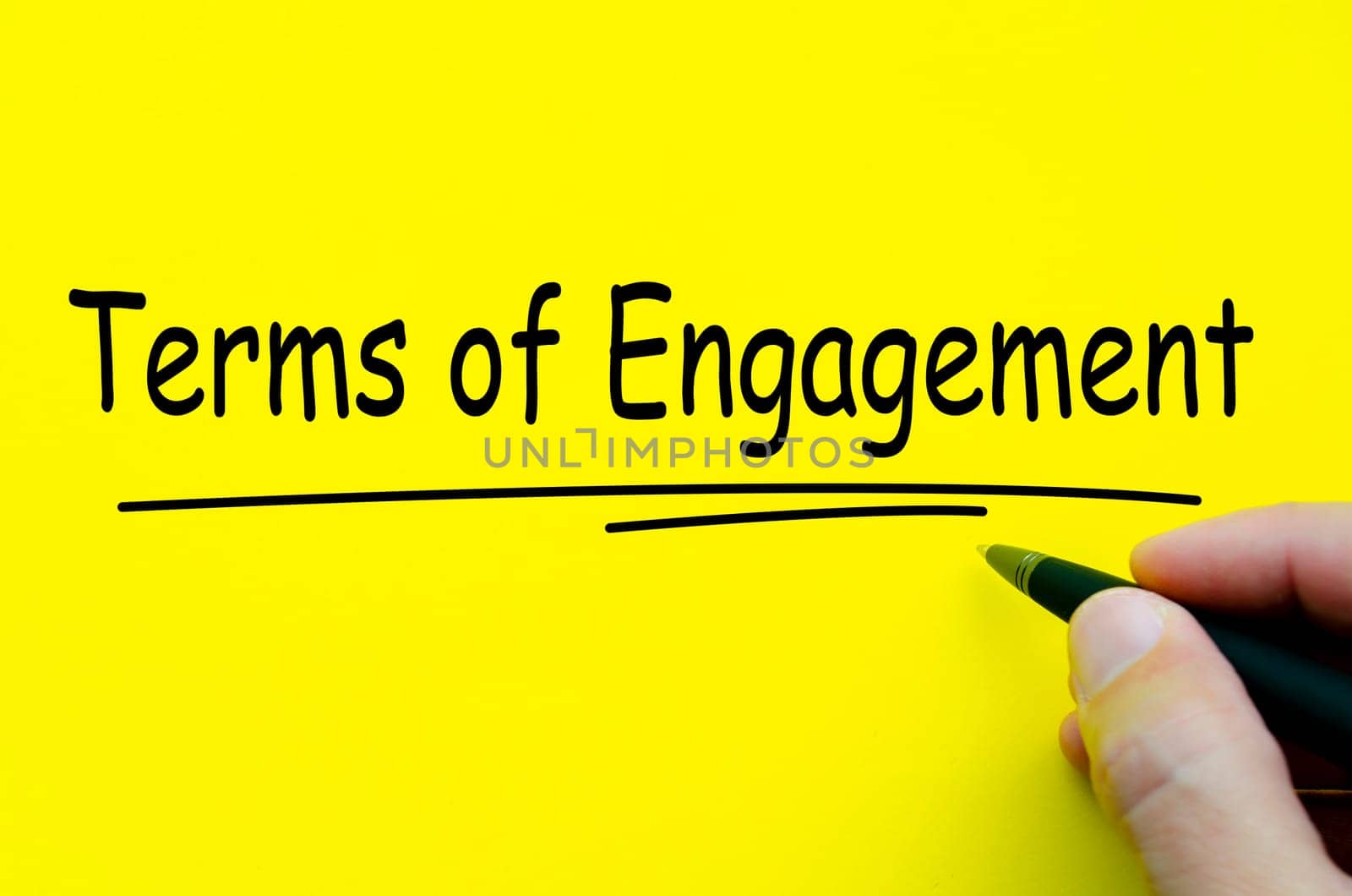 Terms of Engagement text on yellow notepad. Agreement concept.