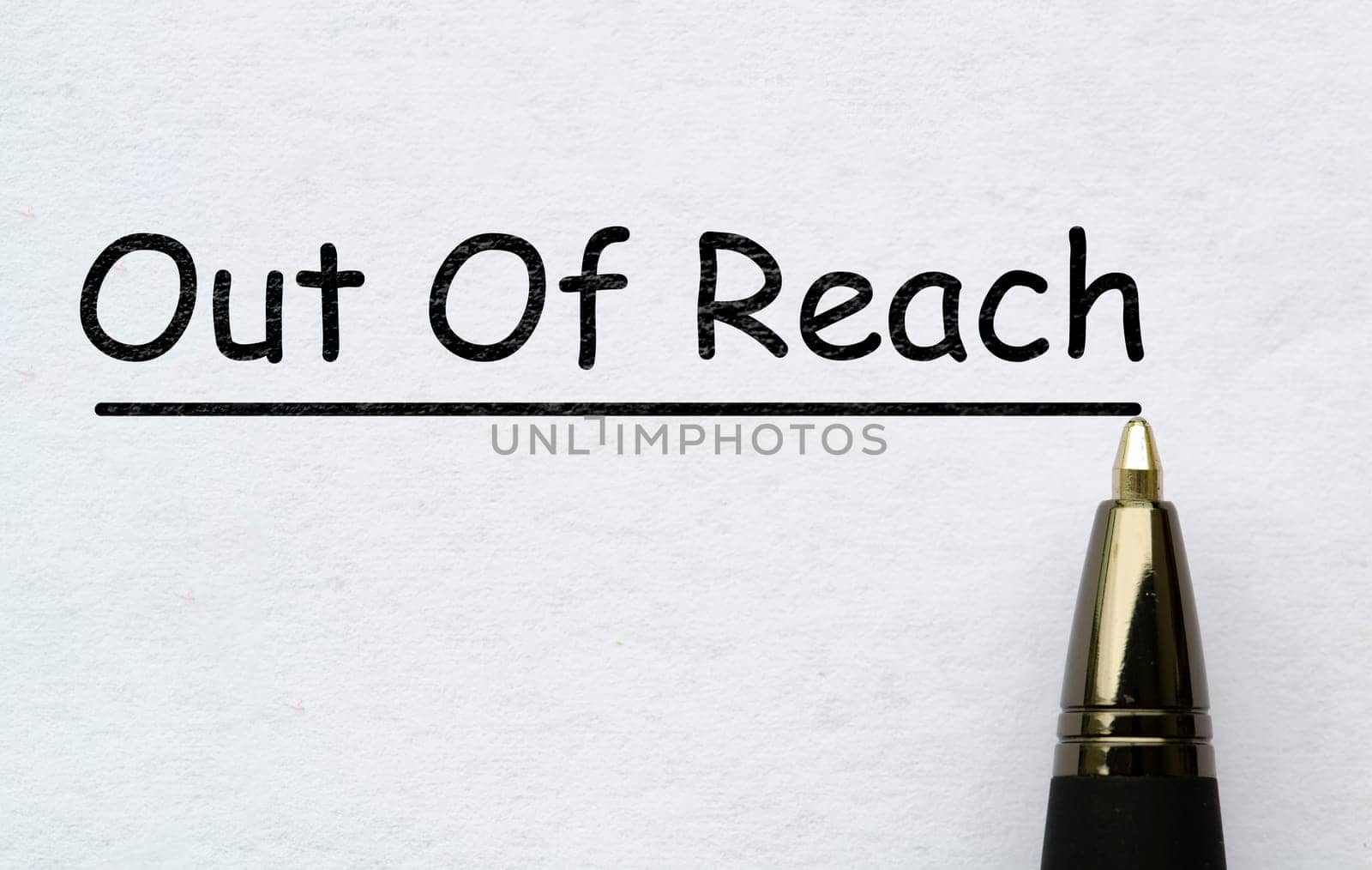 Out of reach text on white paper. Out of office concept.