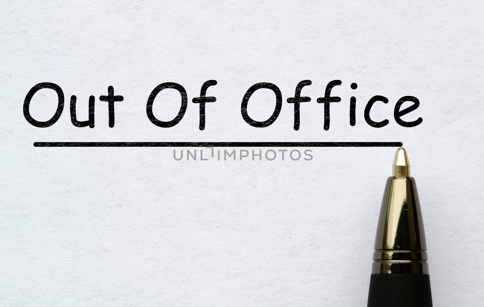 Out of office text on white paper. Vacation concept.