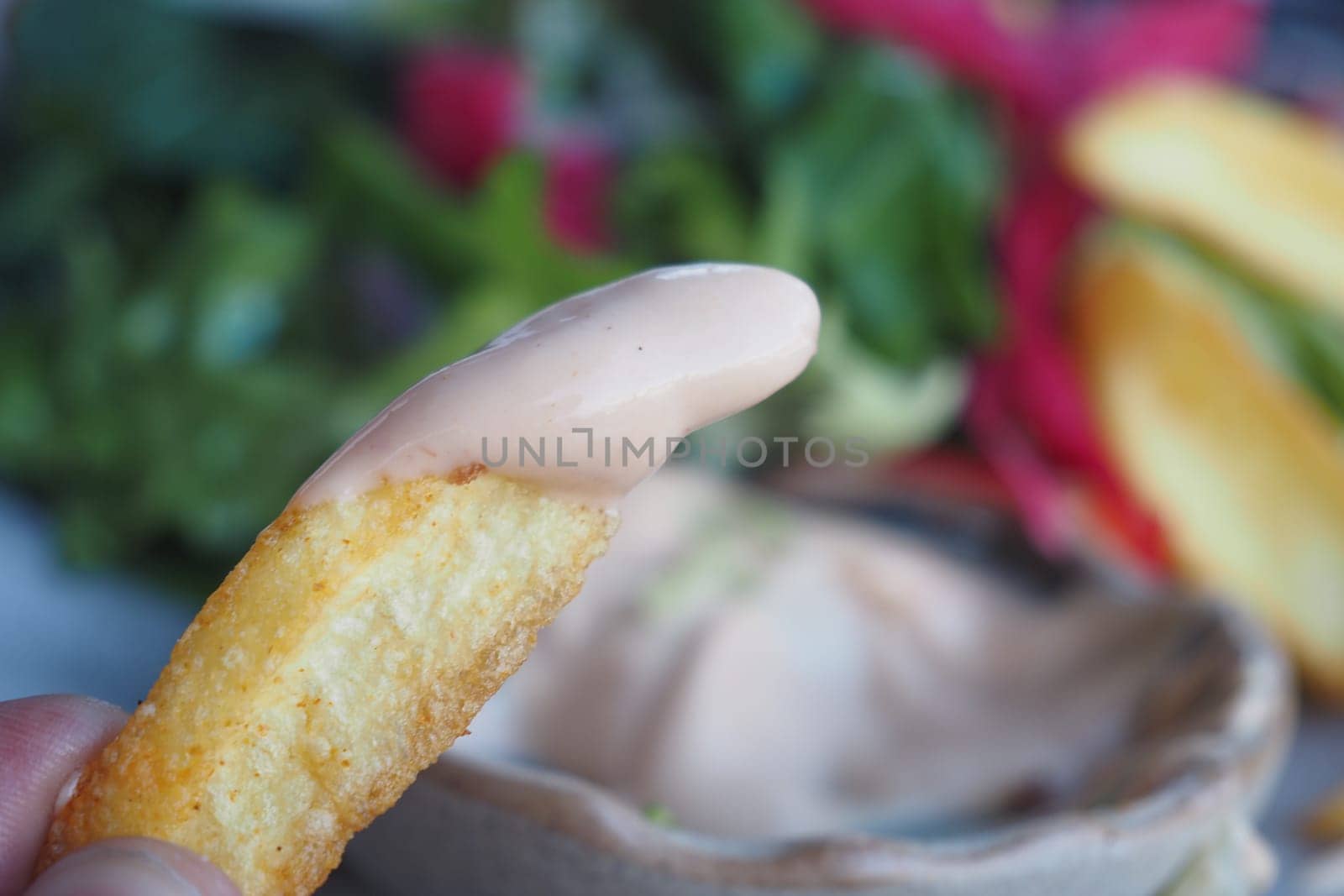 chips dipped in creamy sauce,