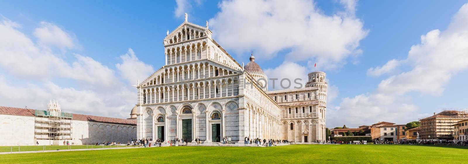 Pisa, Tuscany, Italy - January 04, 2024: Architectural detail of Pisa Cathedral "Catterdrale di Pisa" where tourists are walking on a beautiful winter day