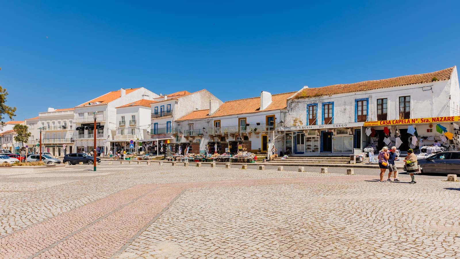 Nazare, Portugal - May 28, 2024: The central square of Nazare Sitio on the hill with its tourists and street vendors on a beautiful spring day