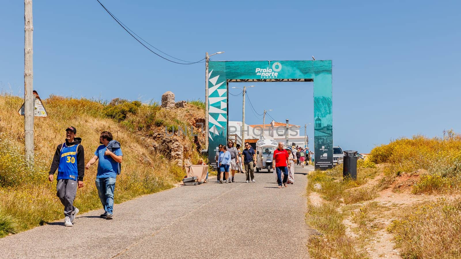 Nazare, Portugal - May 28, 2024: arch welcoming the biggest waves in the world to the hill on a beautiful spring day
