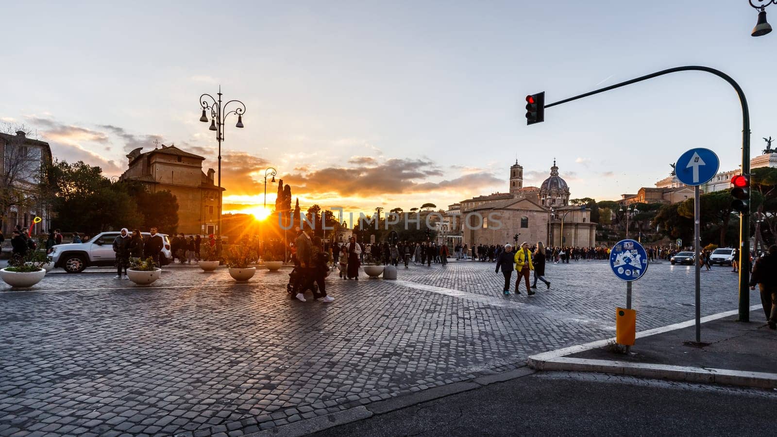 Rome, Italy - December 27, 2023: view of a street in the historic city center where tourists are walking on a winter day