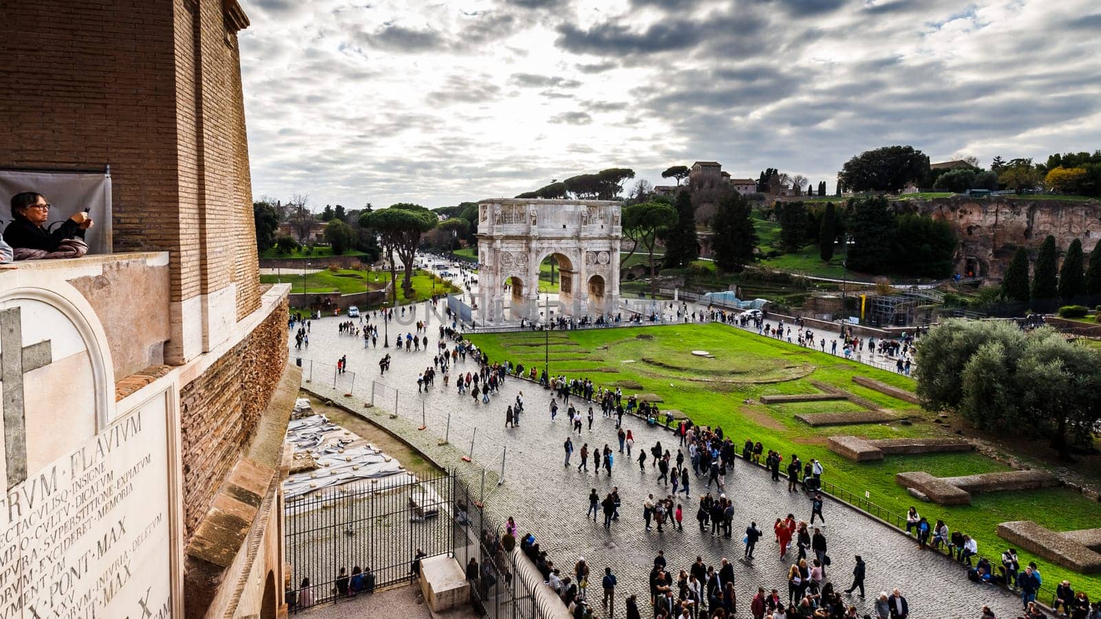 Rome, Italy - December 27, 2023: view of Piazza del Colosseo from the Coliseum of Rome visited by tourists in the historic city center on a winter day